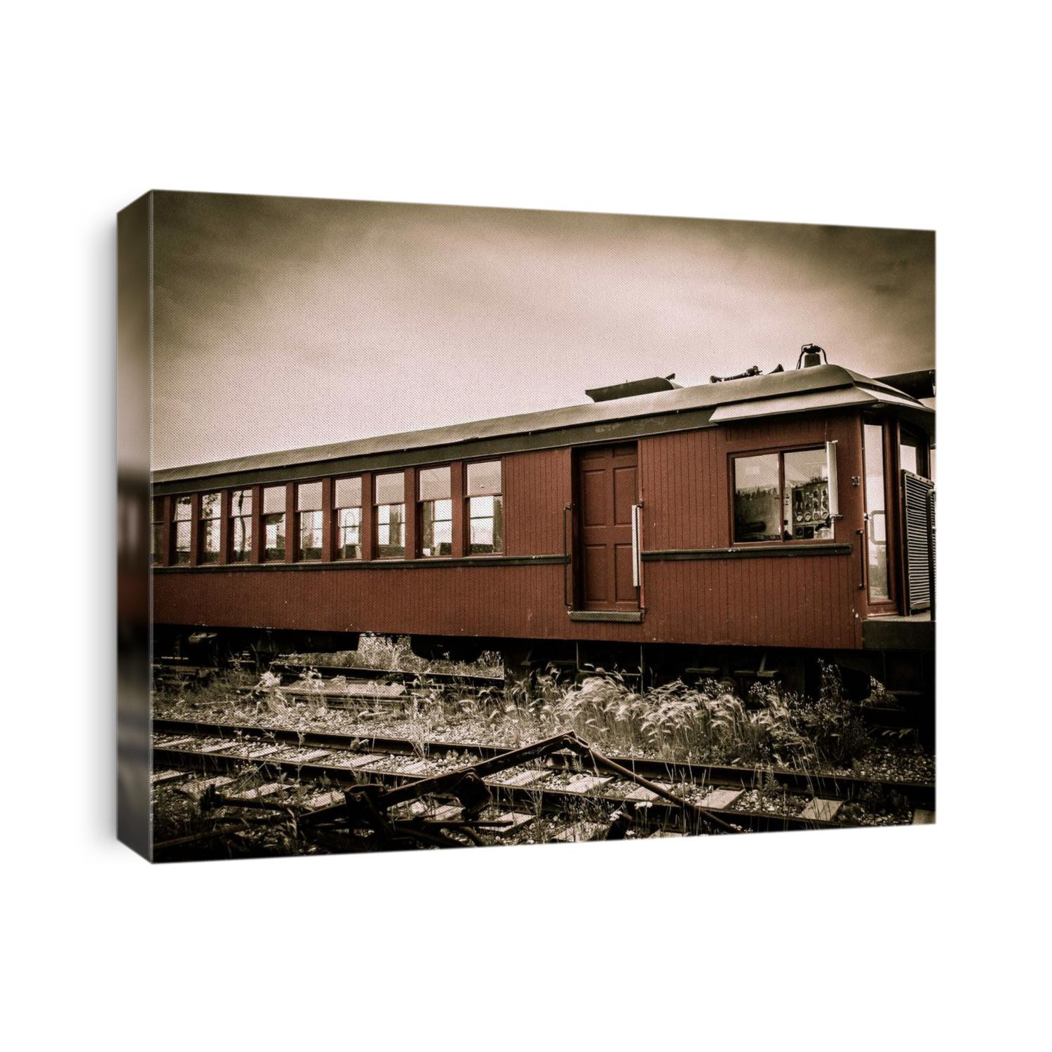 Sepia tinted image of an abandoned train car.
