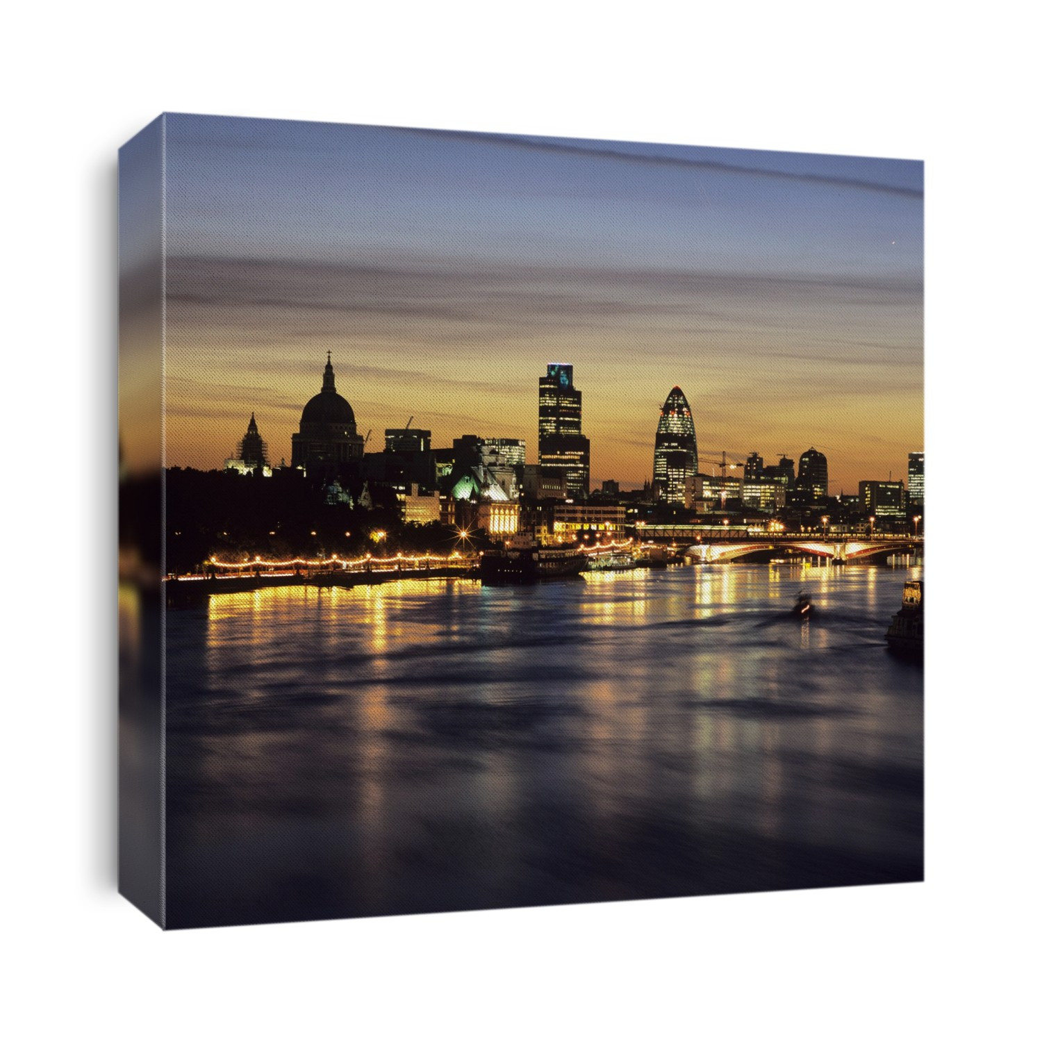 London skyline, UK, at night. From left: St Paul's Cathedral (dome), Tower 42 (also known as NatWest Tower) and 30 St Mary Axe (also known as The Gherkin). Blackfriars Bridge can be seen spanning the River Thames on the right.