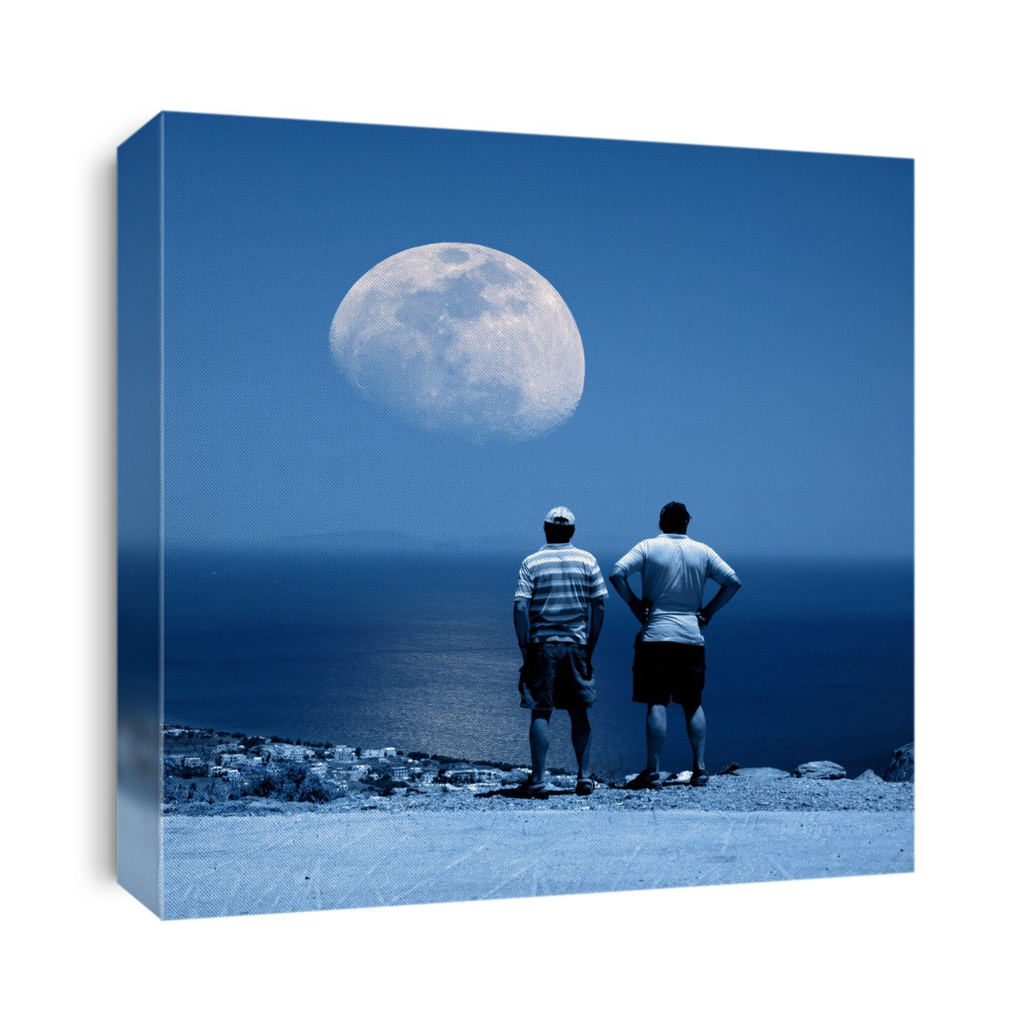 Men watching the Moon rising over the sea.