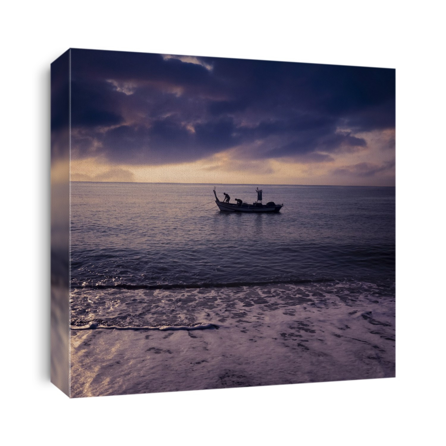 Fishing boat viewed from the shore of Torremolinos Beach at sunrise; Costa del Sol, Malaga Province, Spain