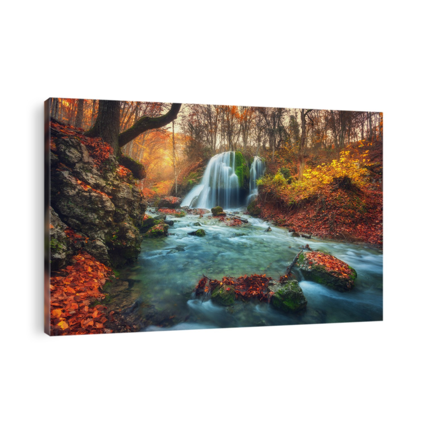 Autumn forest with waterfall at mountain river at sunset. Colorful landscape with trees, stones, waterfall and vibrant red and orange foliage. Nature background. Fall woods. Beautiful blurred water