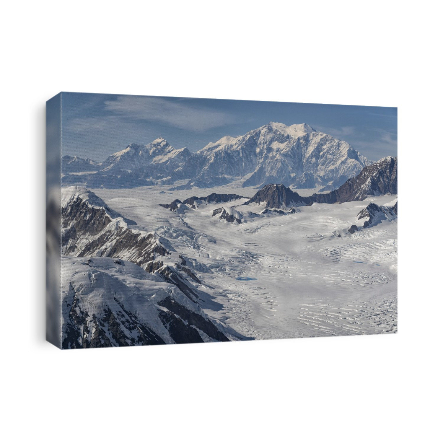 Aerial photo of Kluane National Park, with snow covered mountains making up the landscape and Mount Logan looms in the distance; Haines Junction, Yukon, Canada