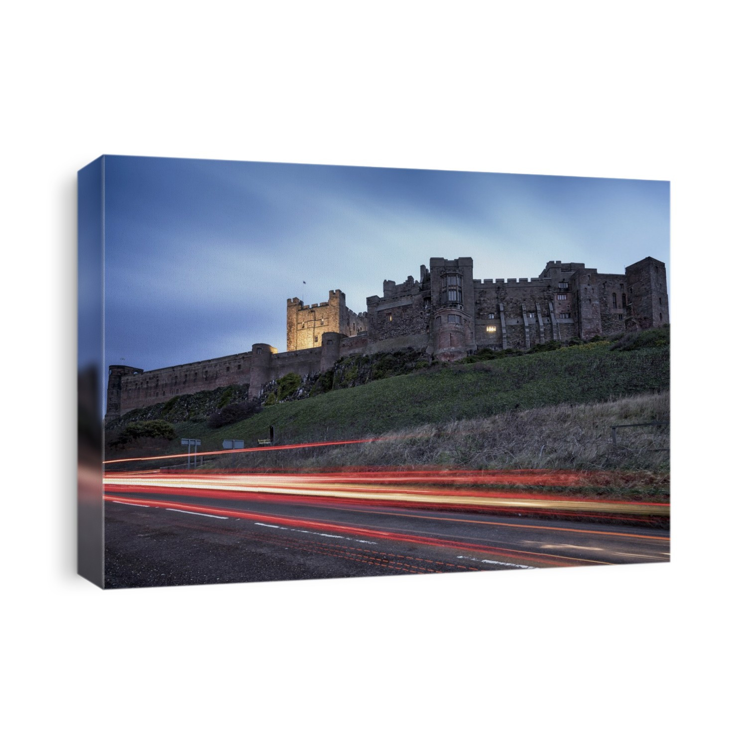 Light Trails On The Road And Bamburgh Castle; Bamburgh, Northumberland, England