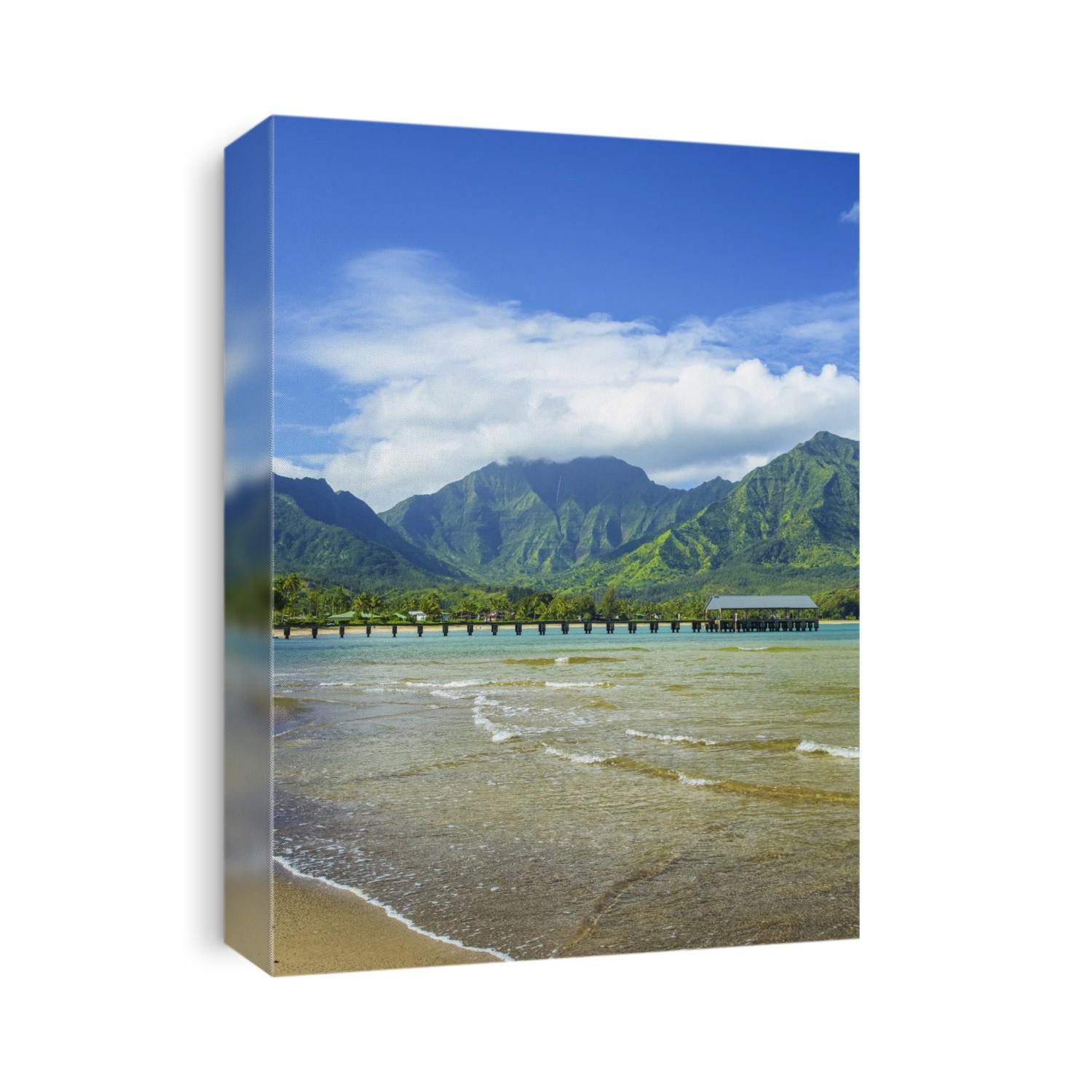 A pier leading out to the ocean water along the coastline with water washing onto the beach in the foreground and rugged, green mountains in the background; Hanalei, Kauai, Hawaii, United States of America
