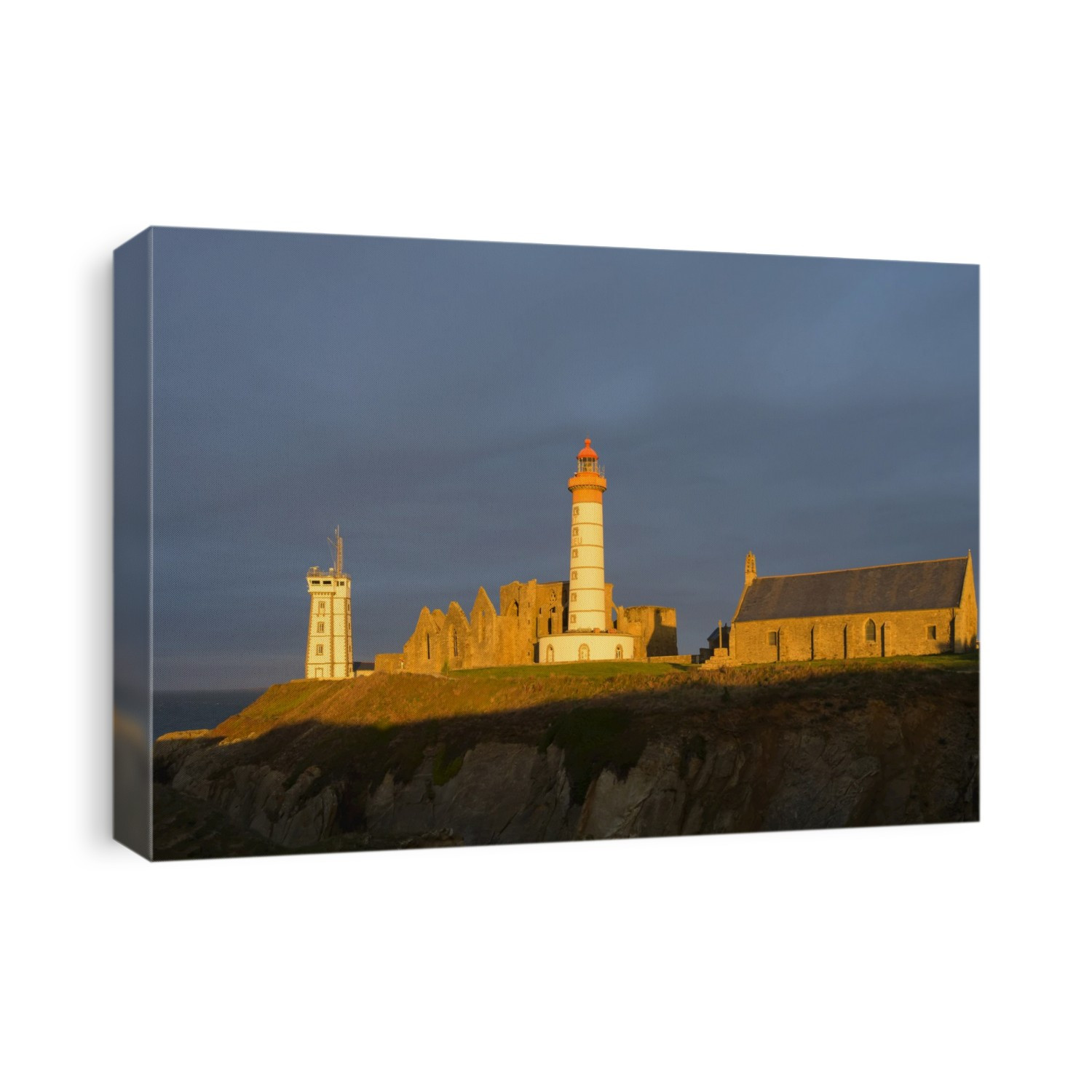 Lighthouse in the morning, Saint Mathieu lighthouse with ruin of Benedictine abbey, Pointe Saint-Mathieu, Plougonvelin, Finistere, Brittany, France