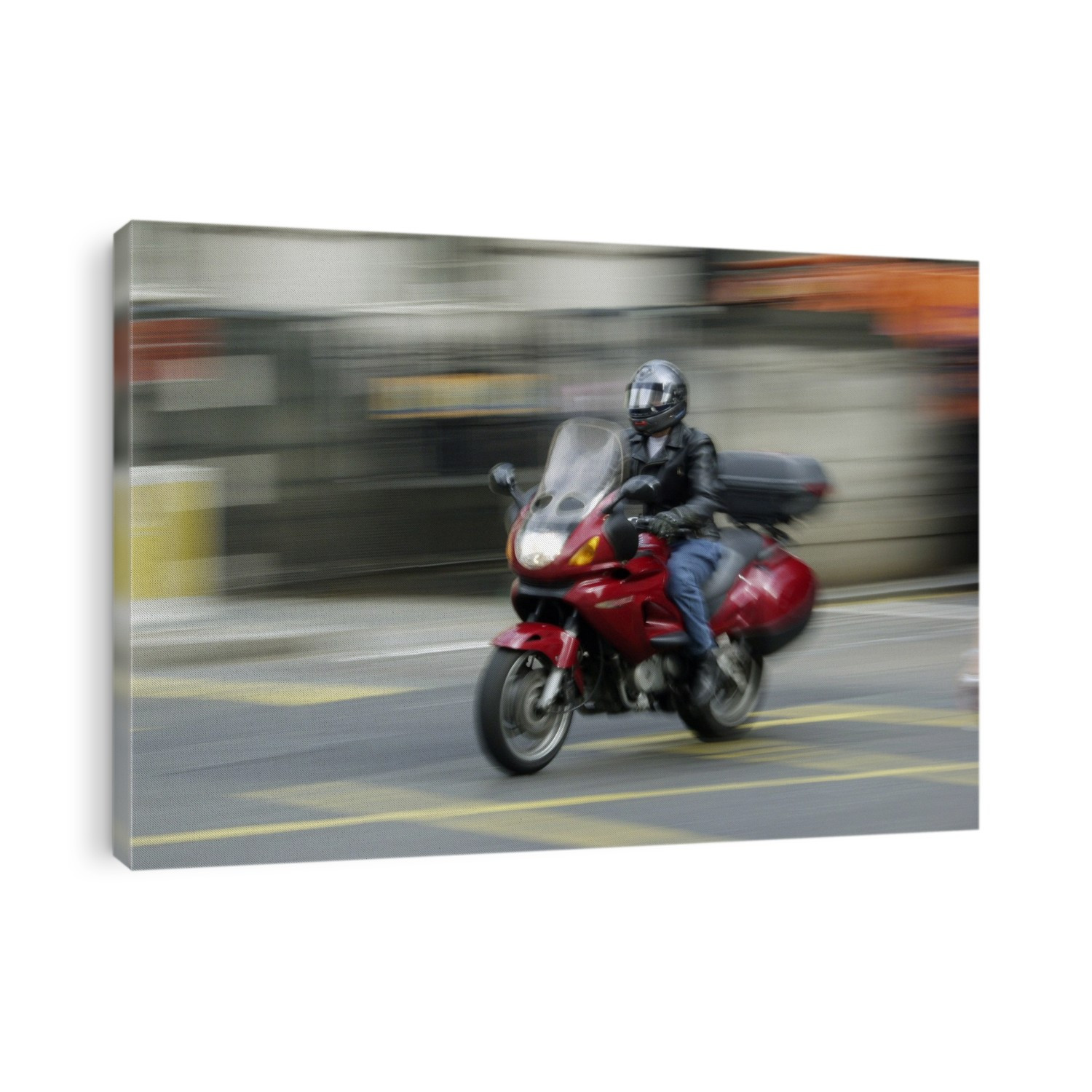 MODEL RELEASED. Motorcycle. Man riding a motorcycle along a city road.