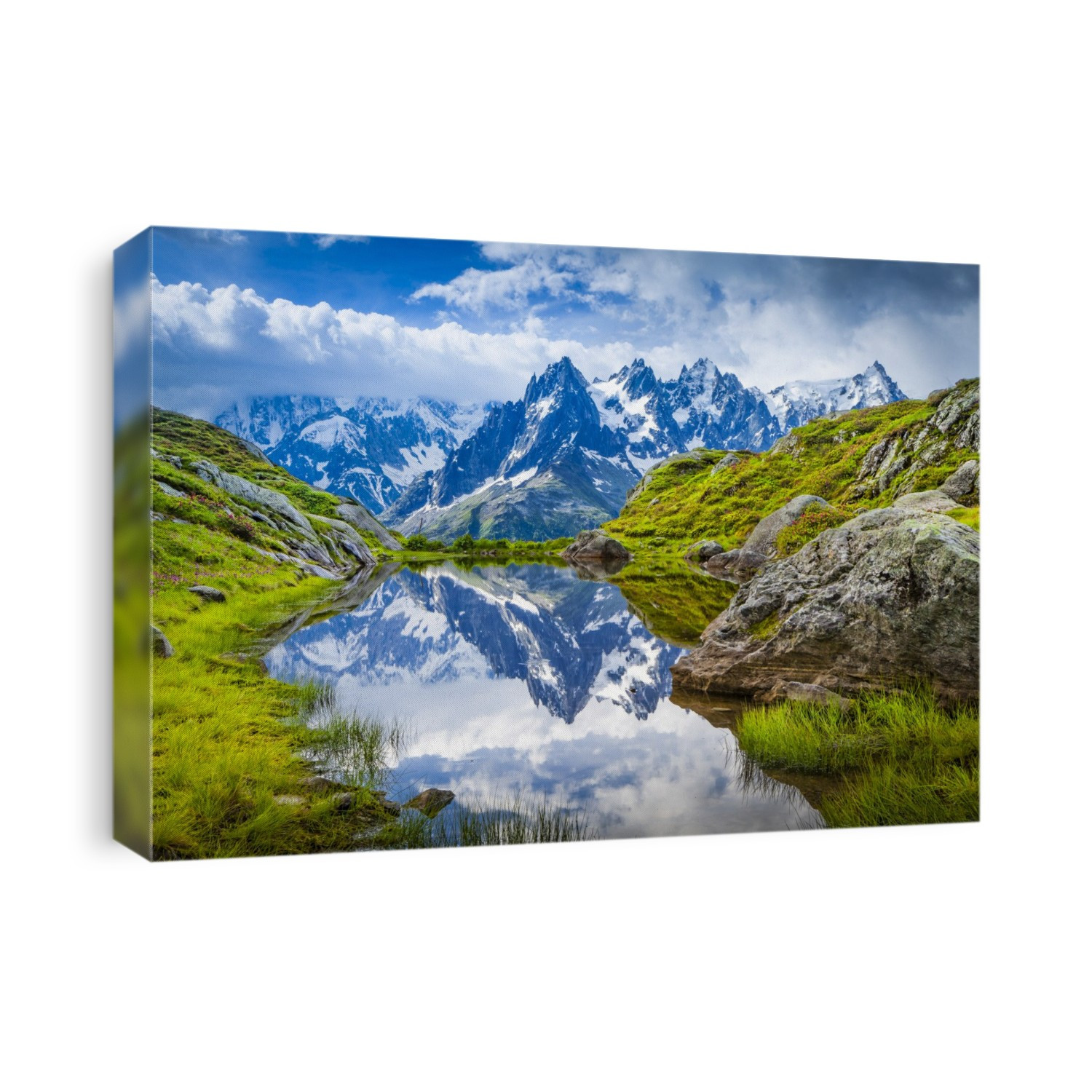 Aiguille des Charmoz, part of Aiguilles de Chamonix, reflects on Lac Flegere surrounded with green meadow, Aiguilles Rouges; Chamonix-Mont-Blanc, Haute-Savoie, France
