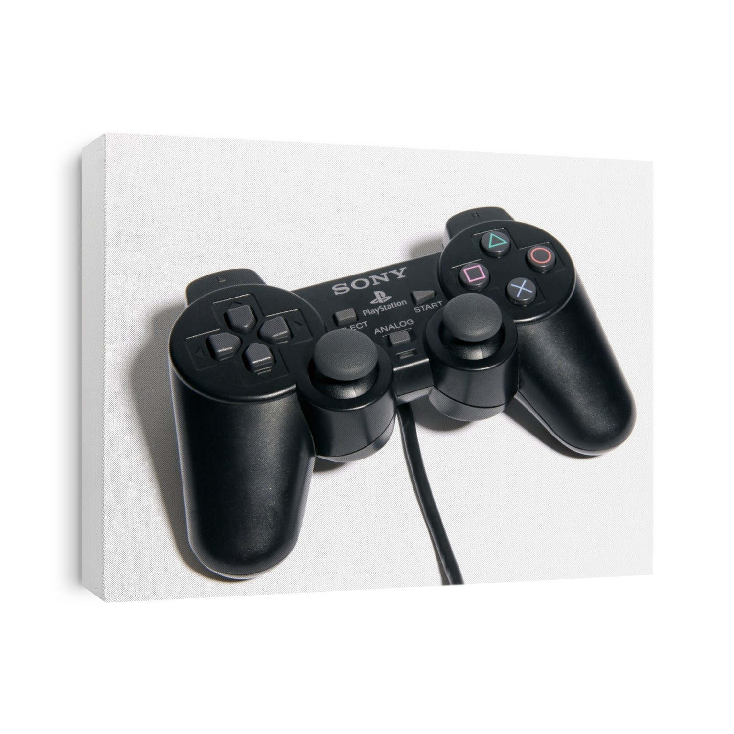 Video game controller. This handheld controller is connected to a console (not seen) and is used to navigate through the game.