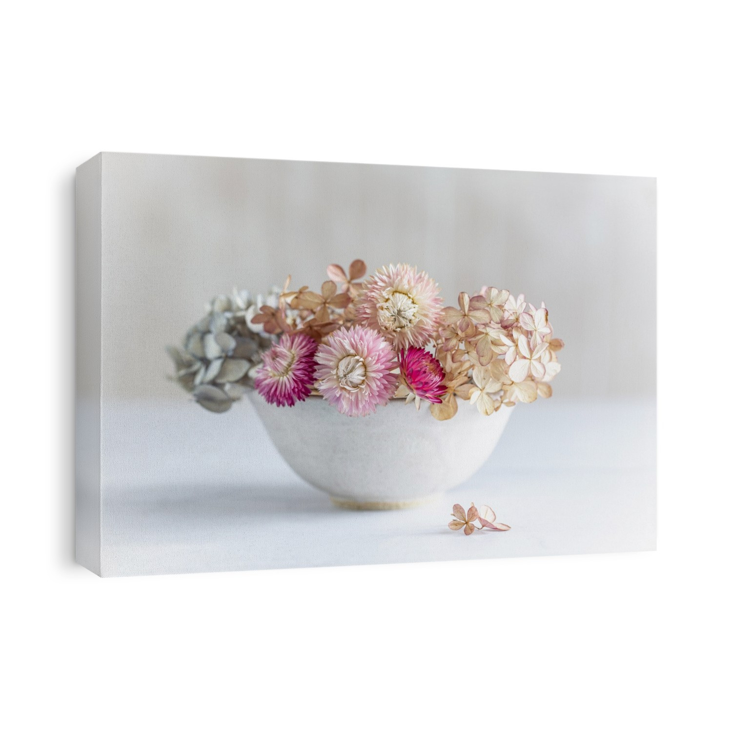 Pastel dried flowers in a bowl.