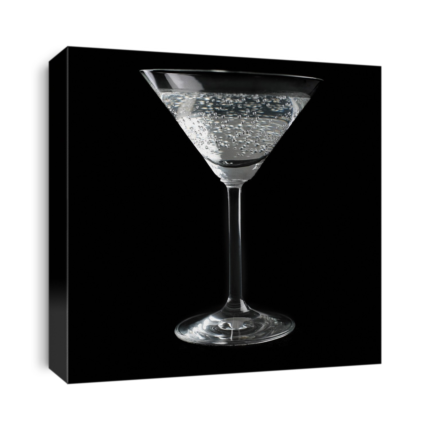 Cocktail glass and drink against a black background.