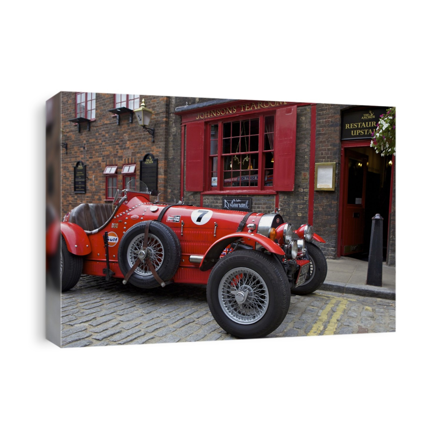 Classic red Bugatti outside The Anchor Pub and Johnson's Tearoom.