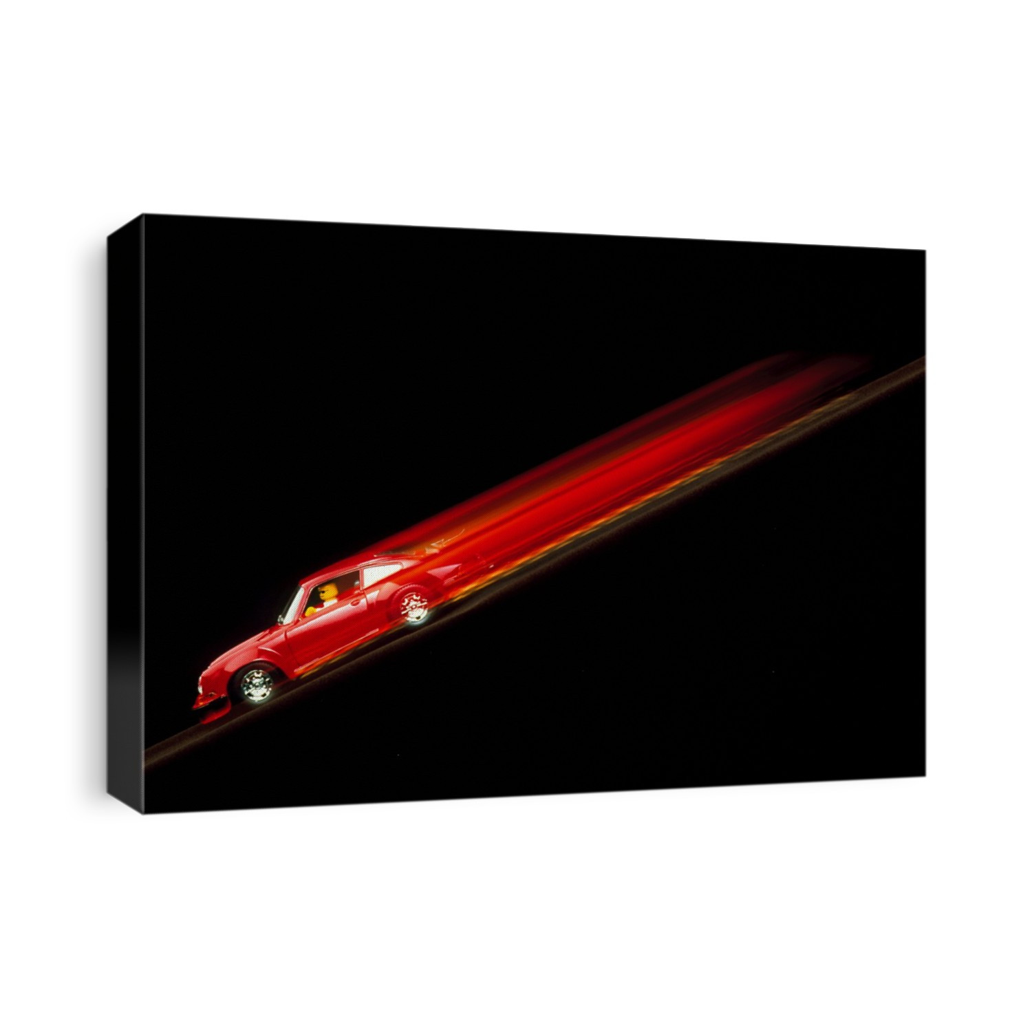 Toy car. Time exposure image of a toy car descending a ramp. Raising and lowering the ramp demonstrates, and can be used to teach children about, the concepts of gravity, motion and forces.