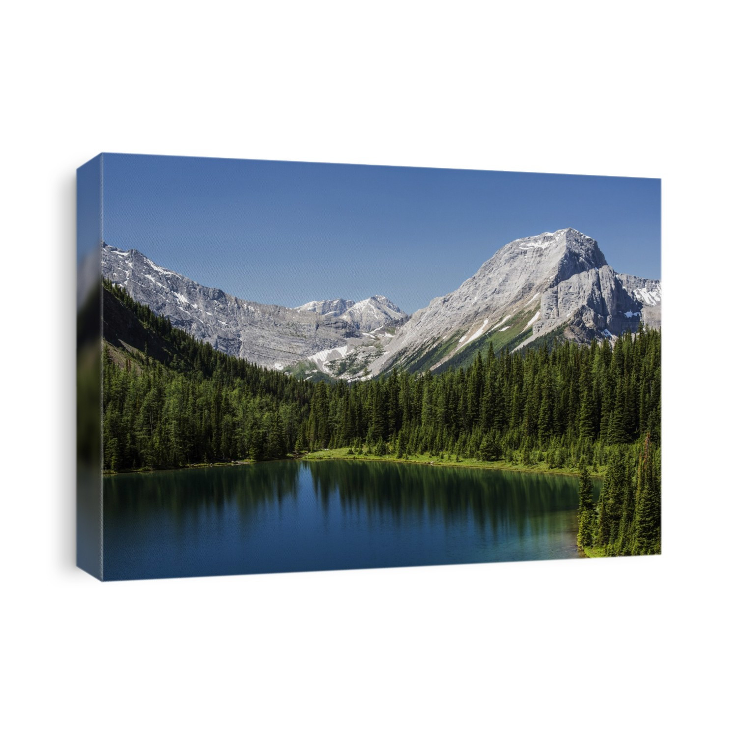 Colourful alpine lake surrounded by mountains and blue sky, Spray Lake Provincial Park; Kananaskis Country, Alberta, Canada
