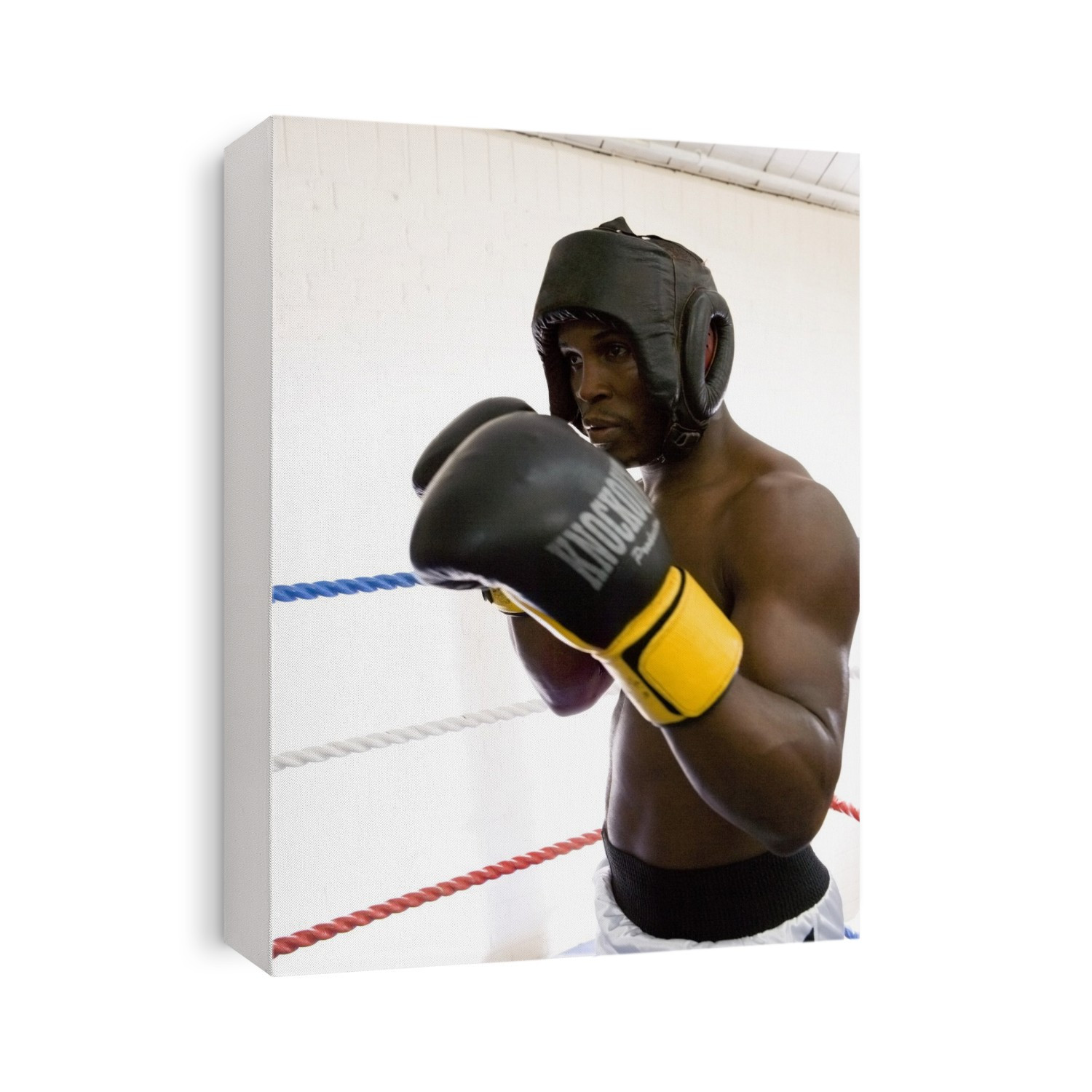 MODEL RELEASED. Boxer sparring with an unseen opponent. Boxing is a combat sport where two opponents of equal weight hit each other with gloved fists. Punches are only allowed to the head and body. Boxers practice for fights by sparring with each other in the boxing ring. During contests, boxers often aim for a knockout punch that causes the opponent to fall unconscious. Concussion or permanent brain damage can result as a consequence of a knockout punch. Boxers must wear protective equipment such as a gumshield, gloves and, in amateur boxing, head protection.