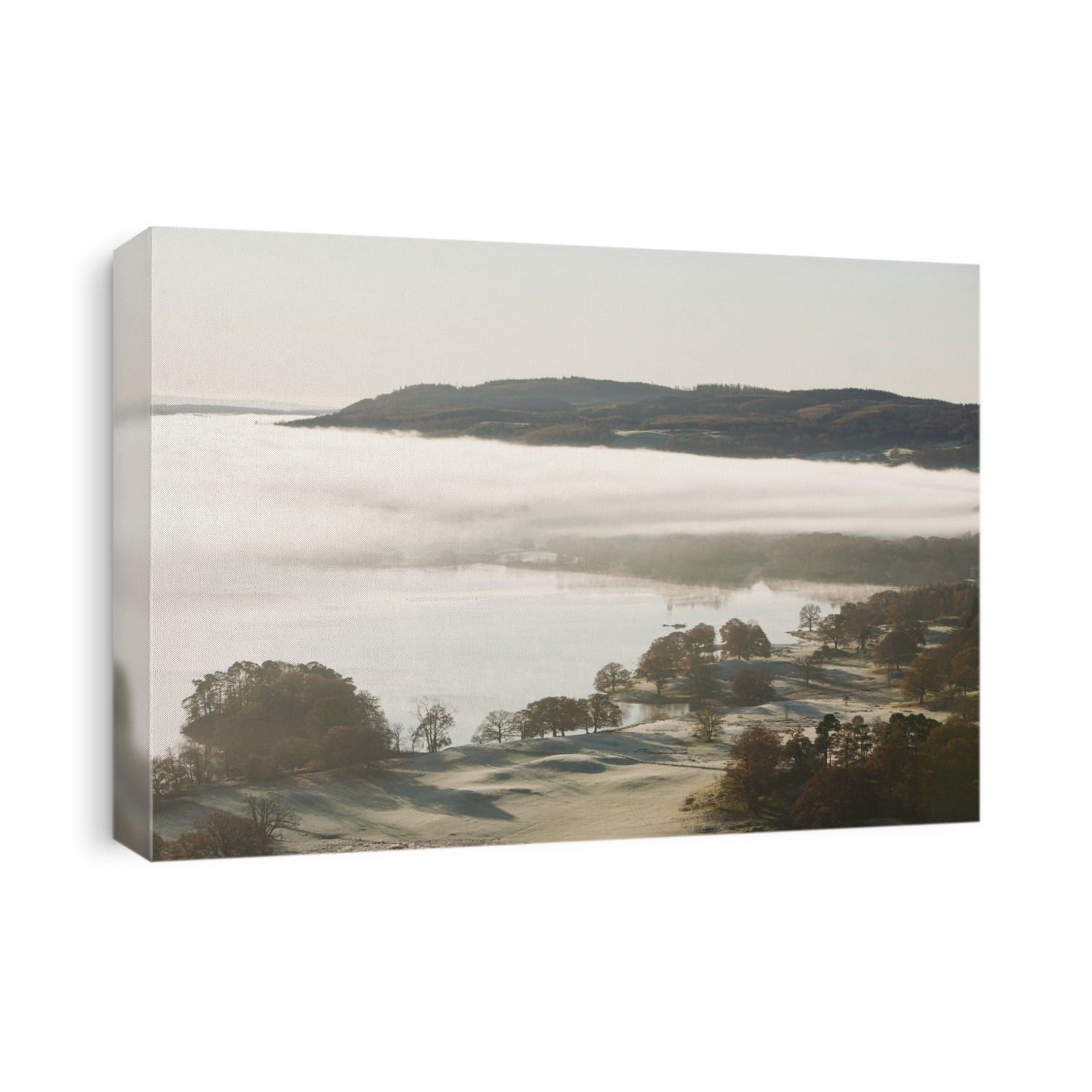 Morning mist over Lake Windermere, Lake District, UK.