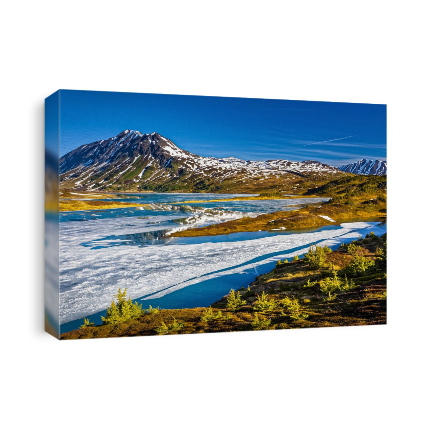 Half frozen Lost Lake in the morning, Chugach Mountains in the background. Chugach National Forest, Kenai Peninsula, South-central Alaska in springtime; Seward, Alaska, United States of America