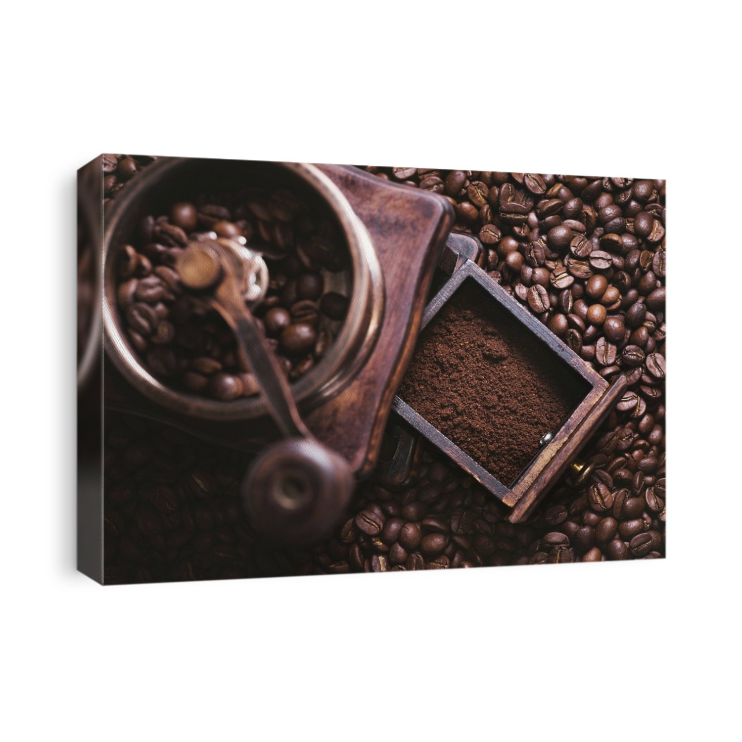 Coffee beans and grinder, high angle.