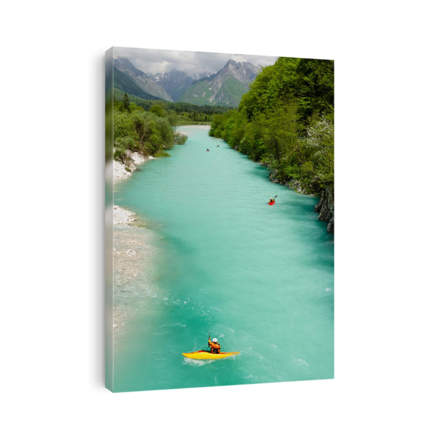 Kayaking on the beautiful turquoise Soca river in the Triglav National Park in Slovenia.