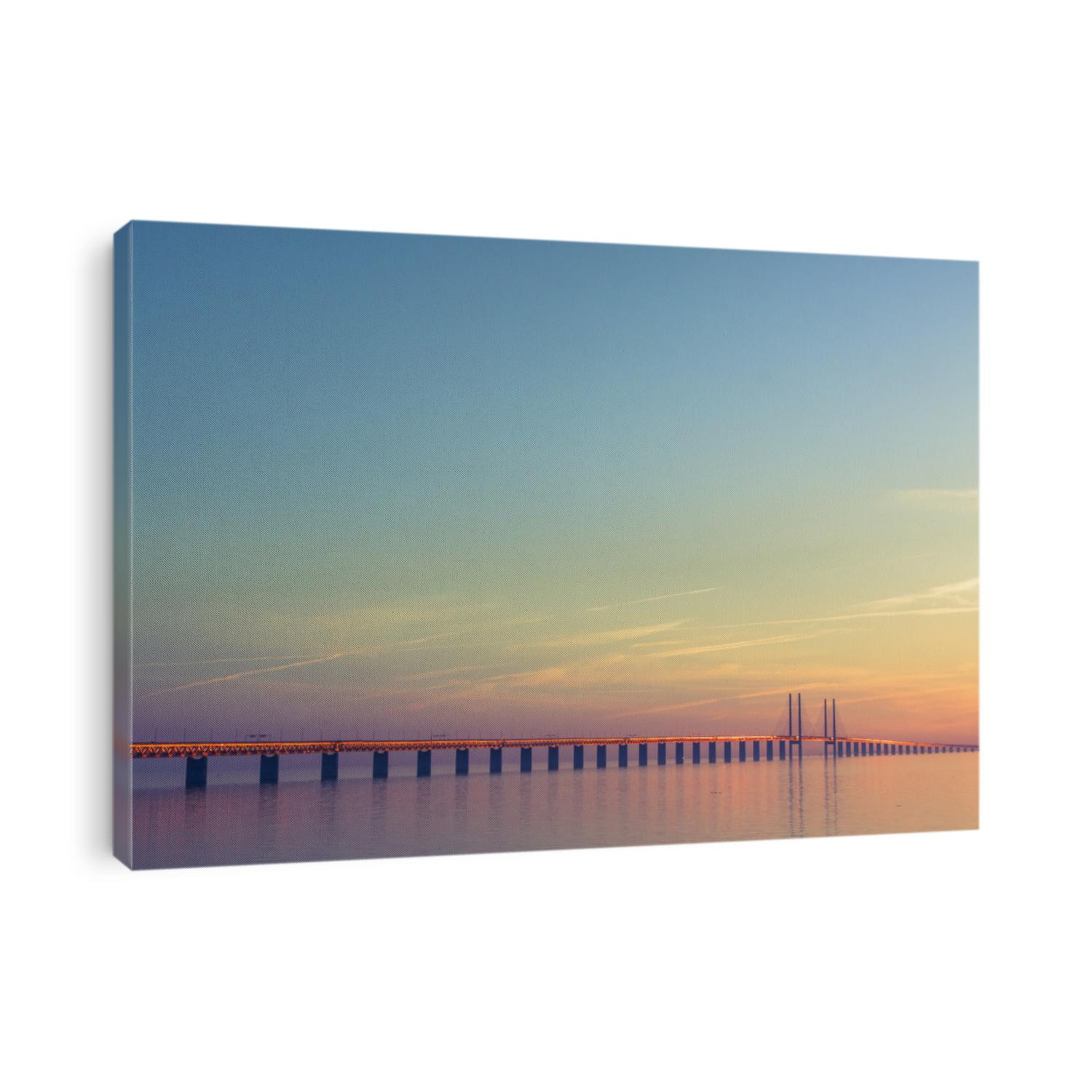 The bridge between Denmark and Sweden, Oresundsbron, in summer sunset with calm weather.