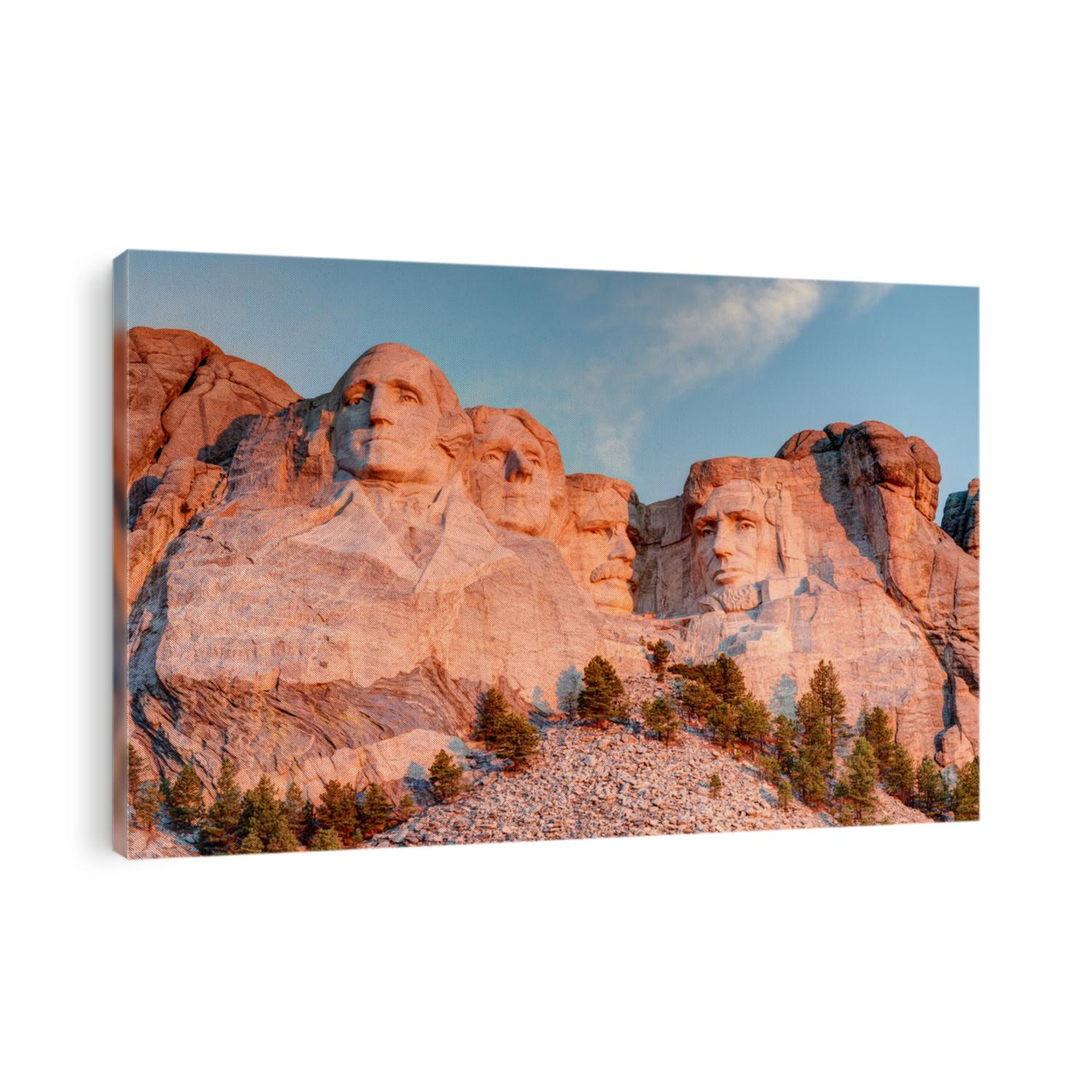 Mount Rushmore National Park in the Black Hills South Dakota during a warm sunrise with clear blue sky morning. High Dynamic Range. / Mount Rushmore National Park