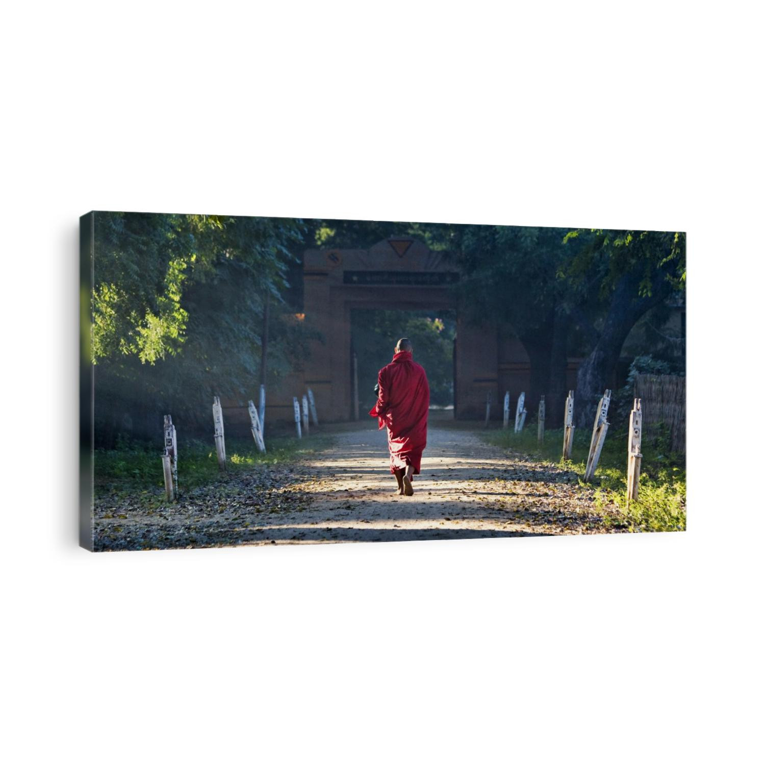 Two monks walking with bowls in Mandalay, Myanmar