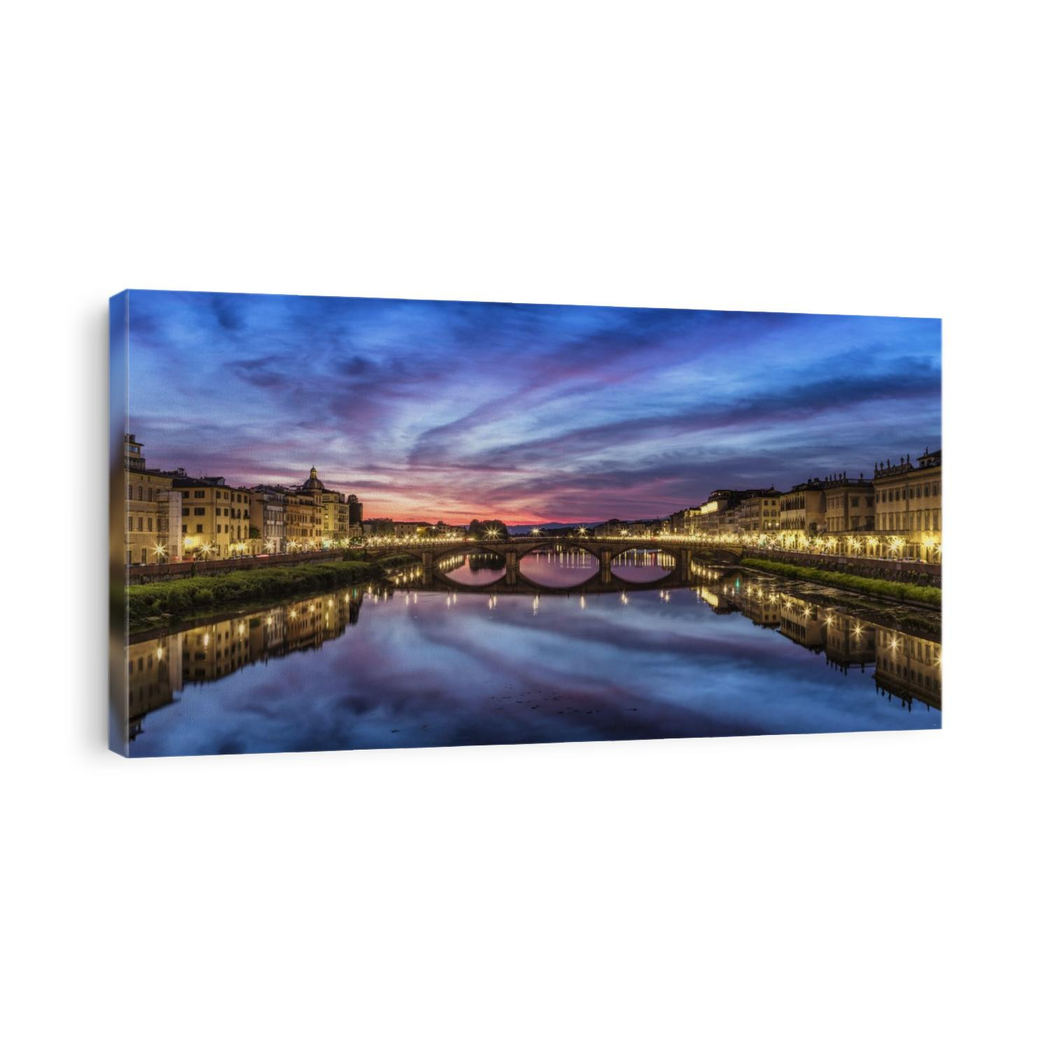 Panorama over the Arno River at sunset in Florence, Italy