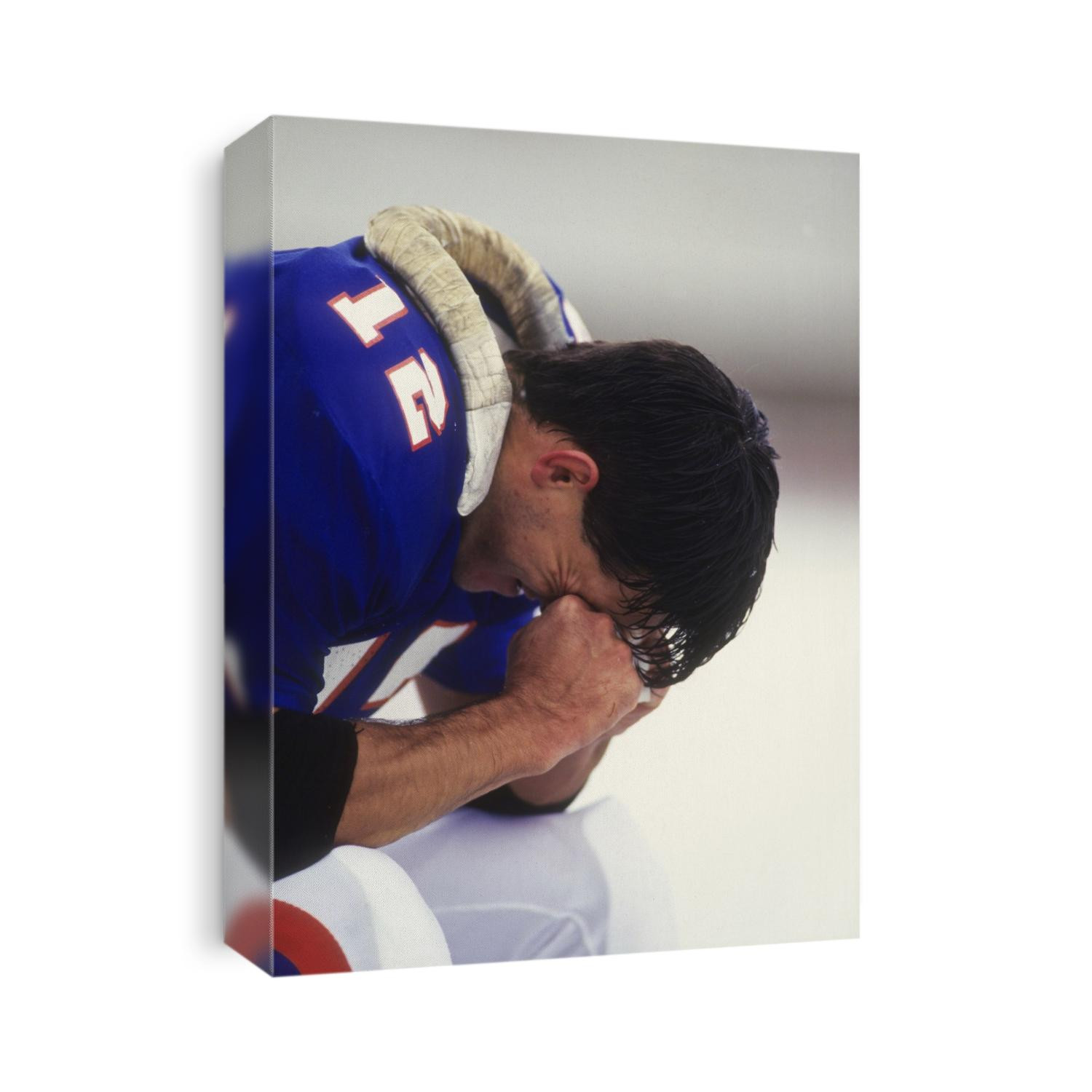 American football player on the bench.