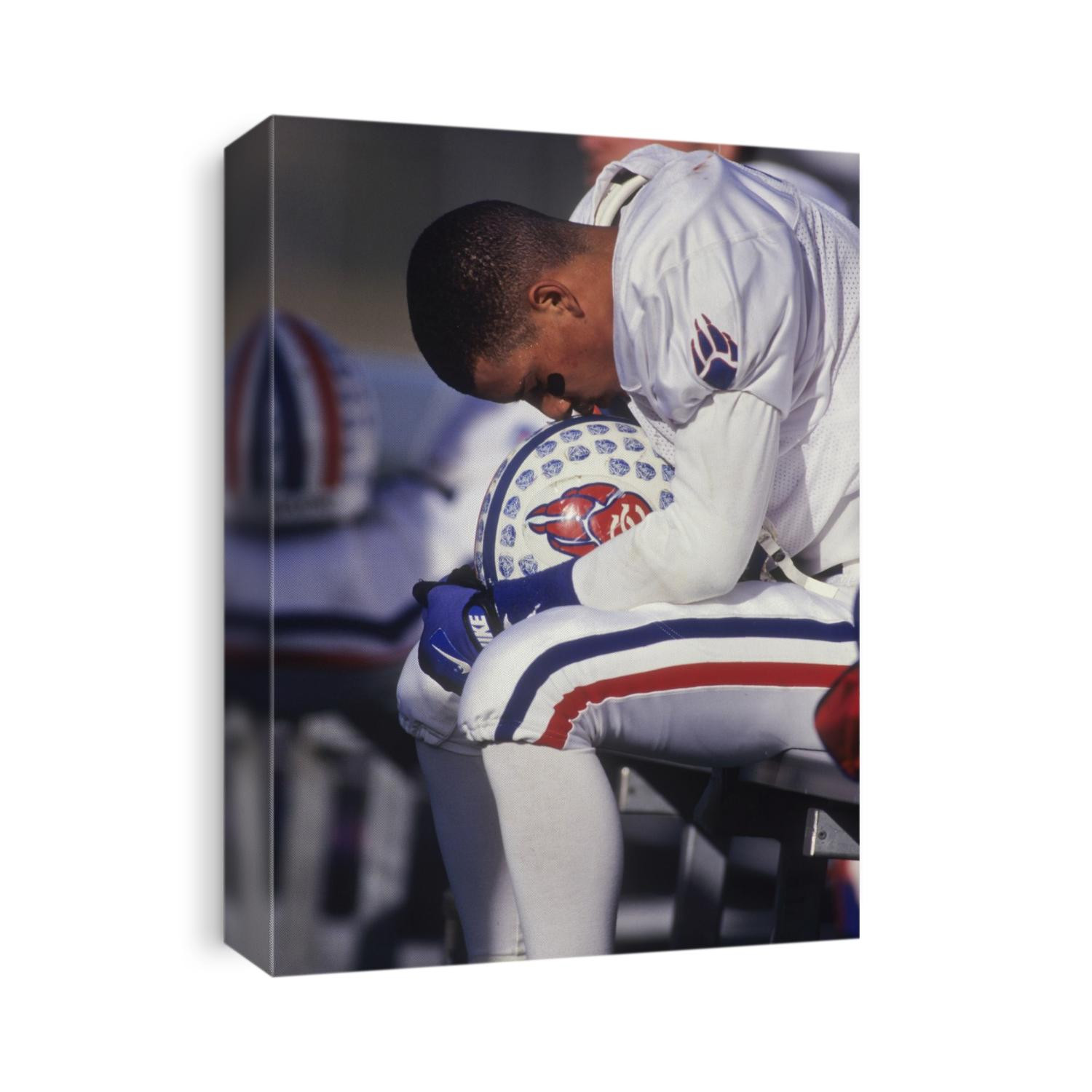 American football player on the bench.