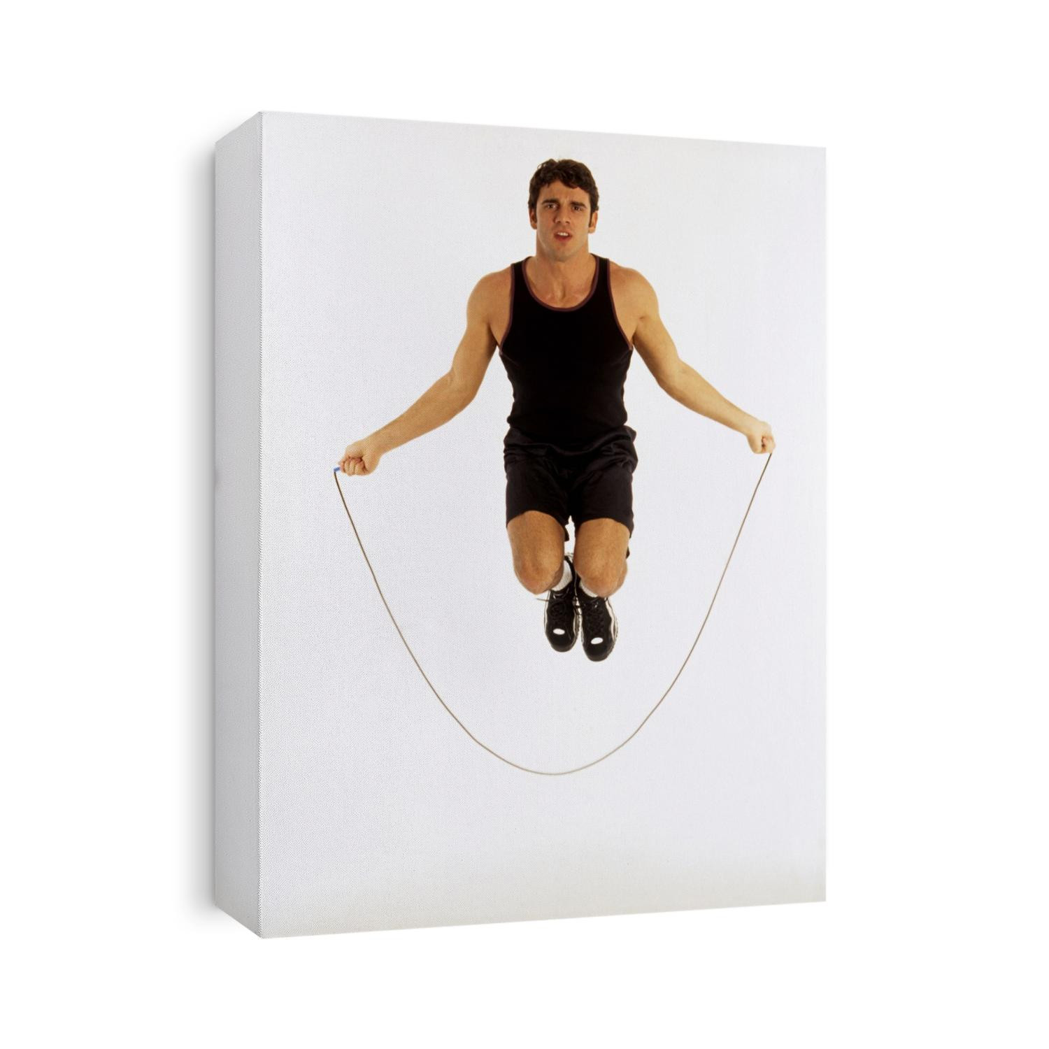 Young man exercising with a jump rope.
