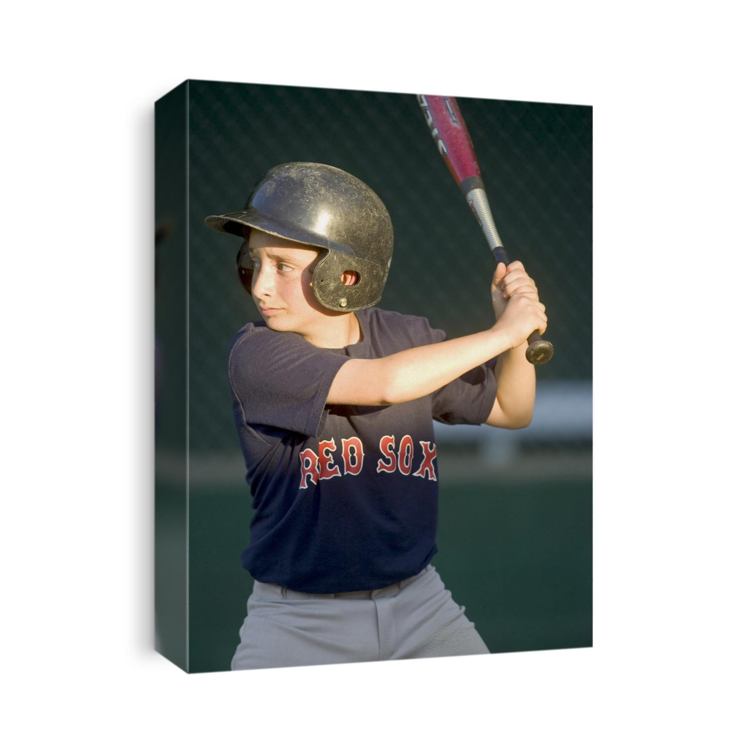 10 year old boy batting during a baseball game.