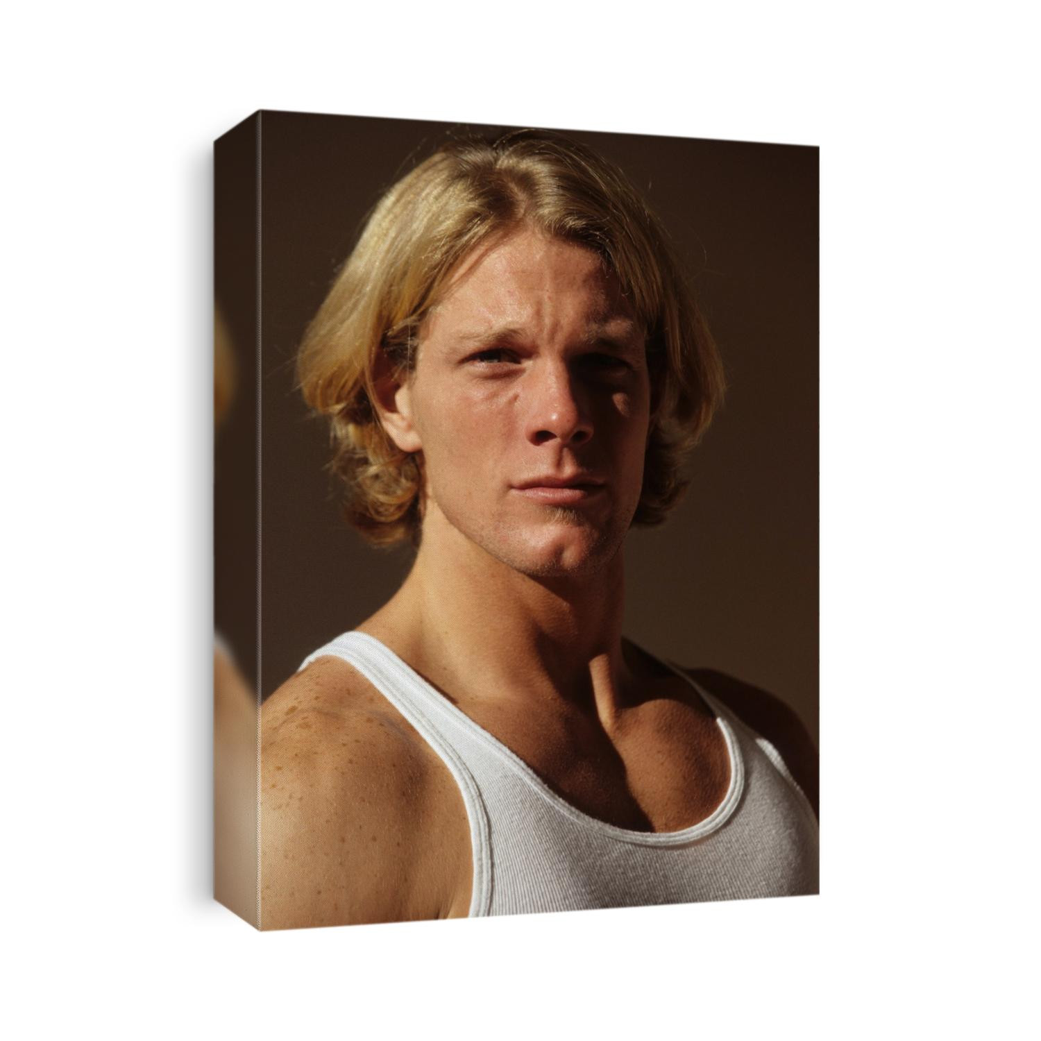 Portrait of young man in fitness studio.