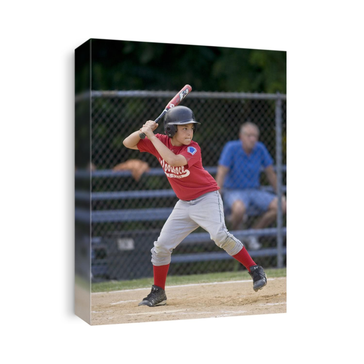 Boys baseball game action.