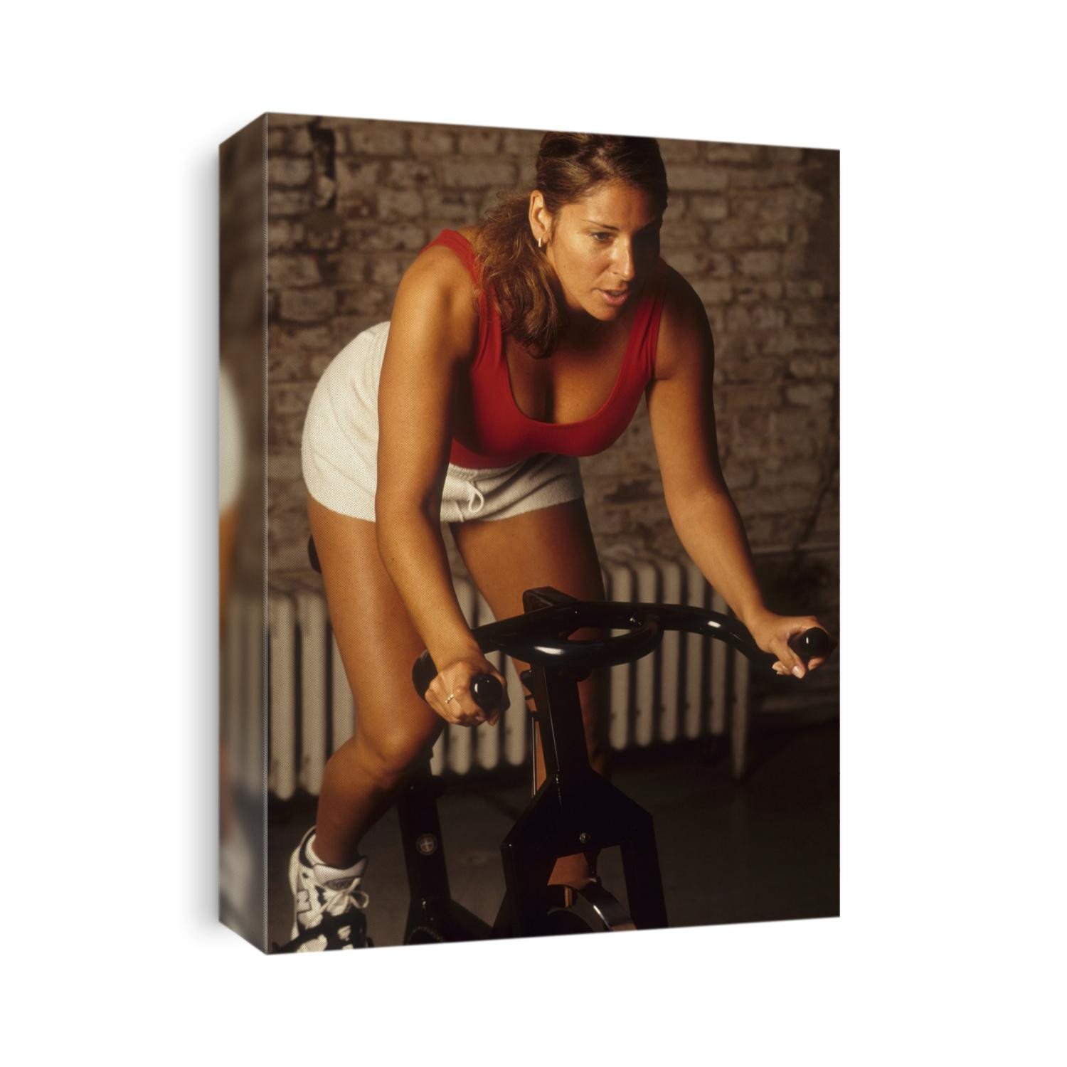 Woman exercising on a stationary bike.