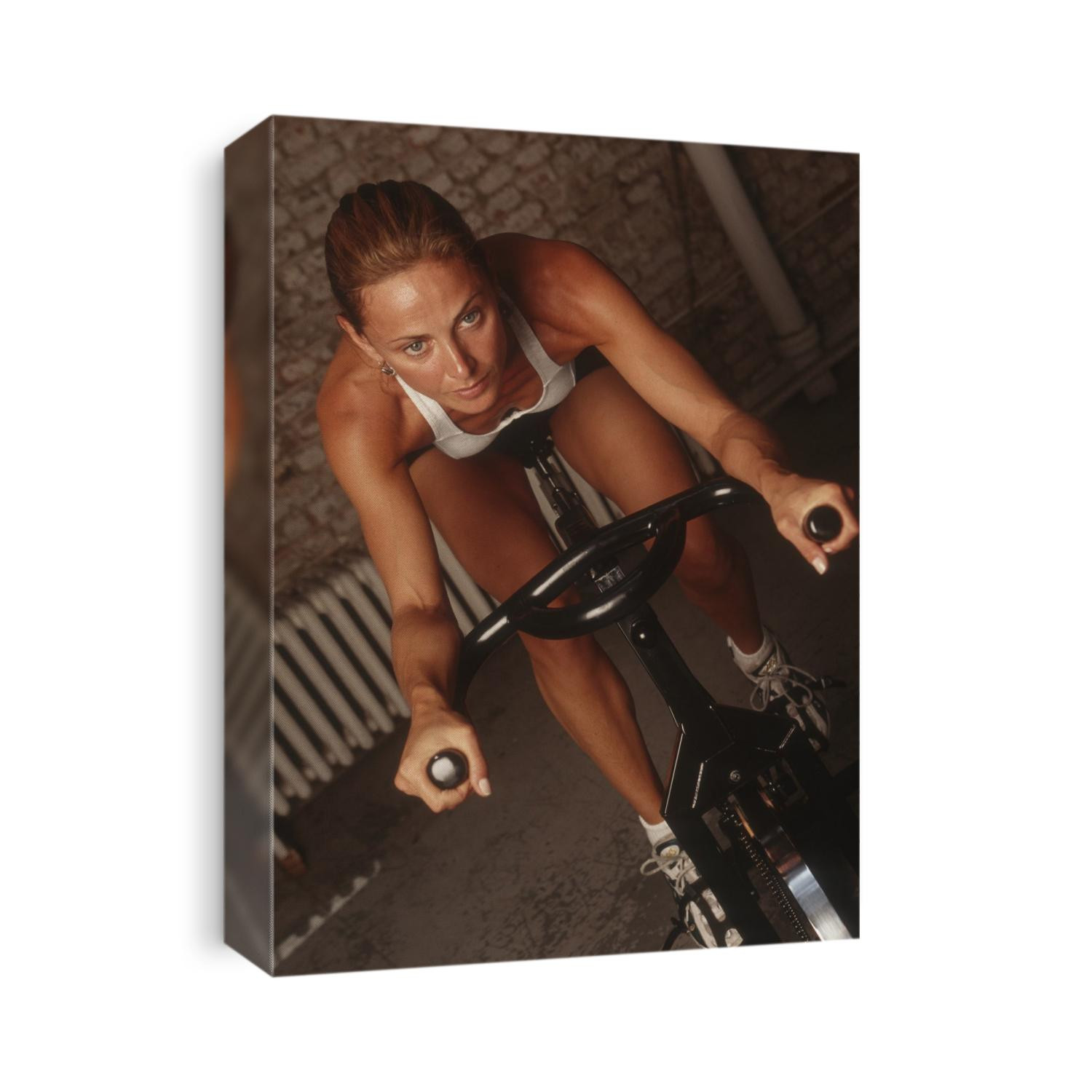 Woman exercising on a stationary bike.