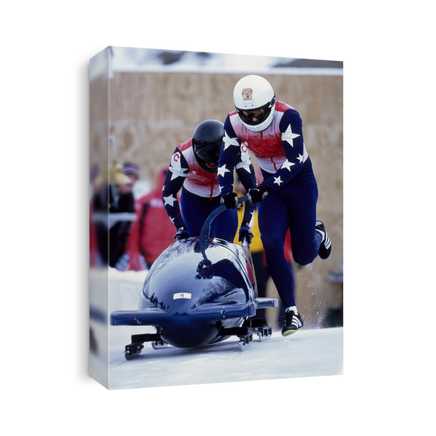 Two man bobsled team pushing off at the start