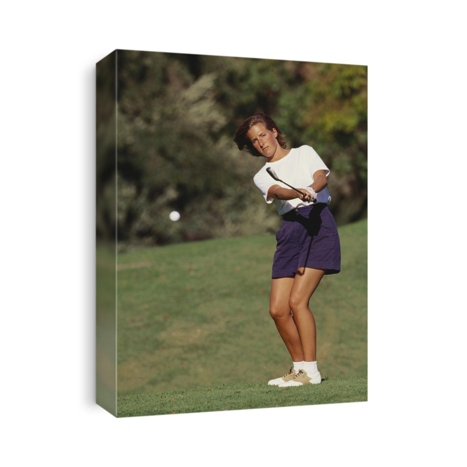 Woman golfer in action.