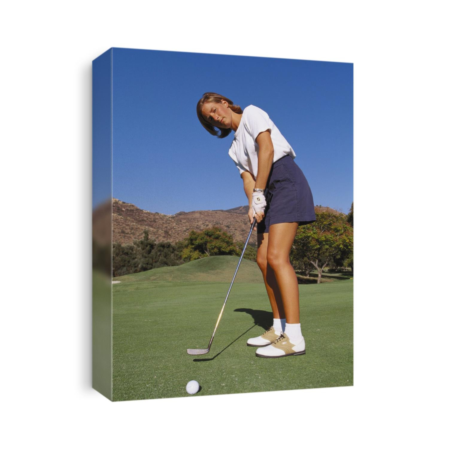 Woman golfer in action.