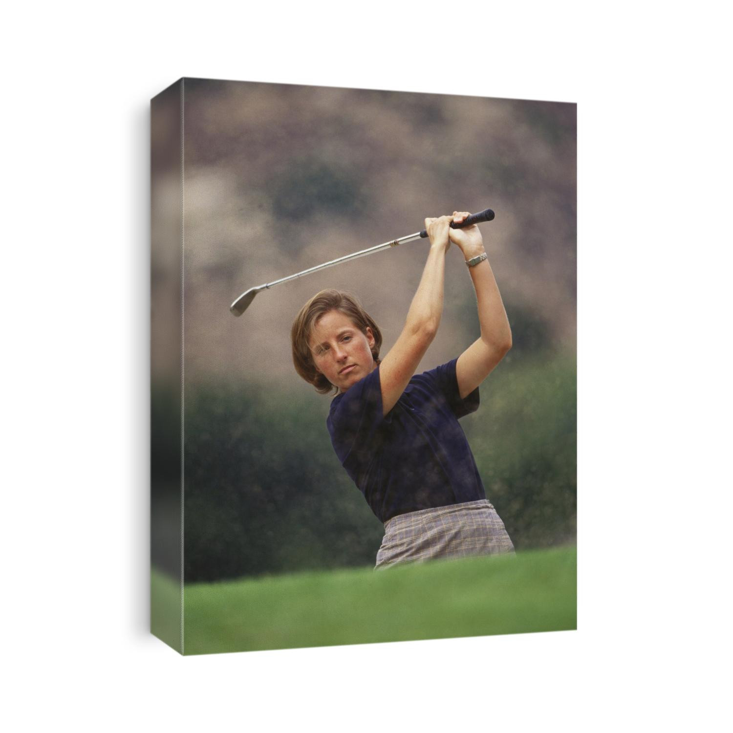 Woman golfer in action.