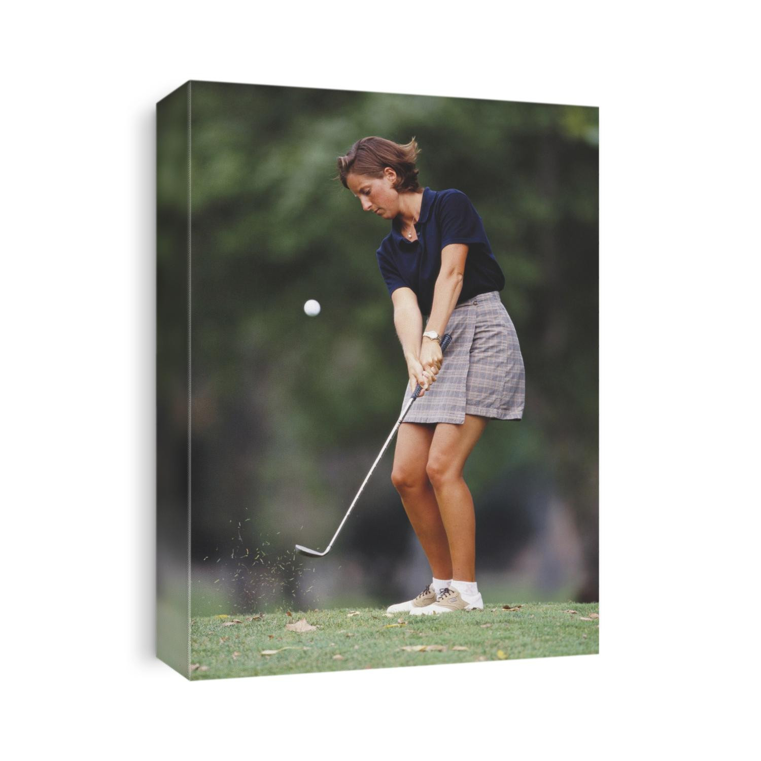Woman golfer in action.