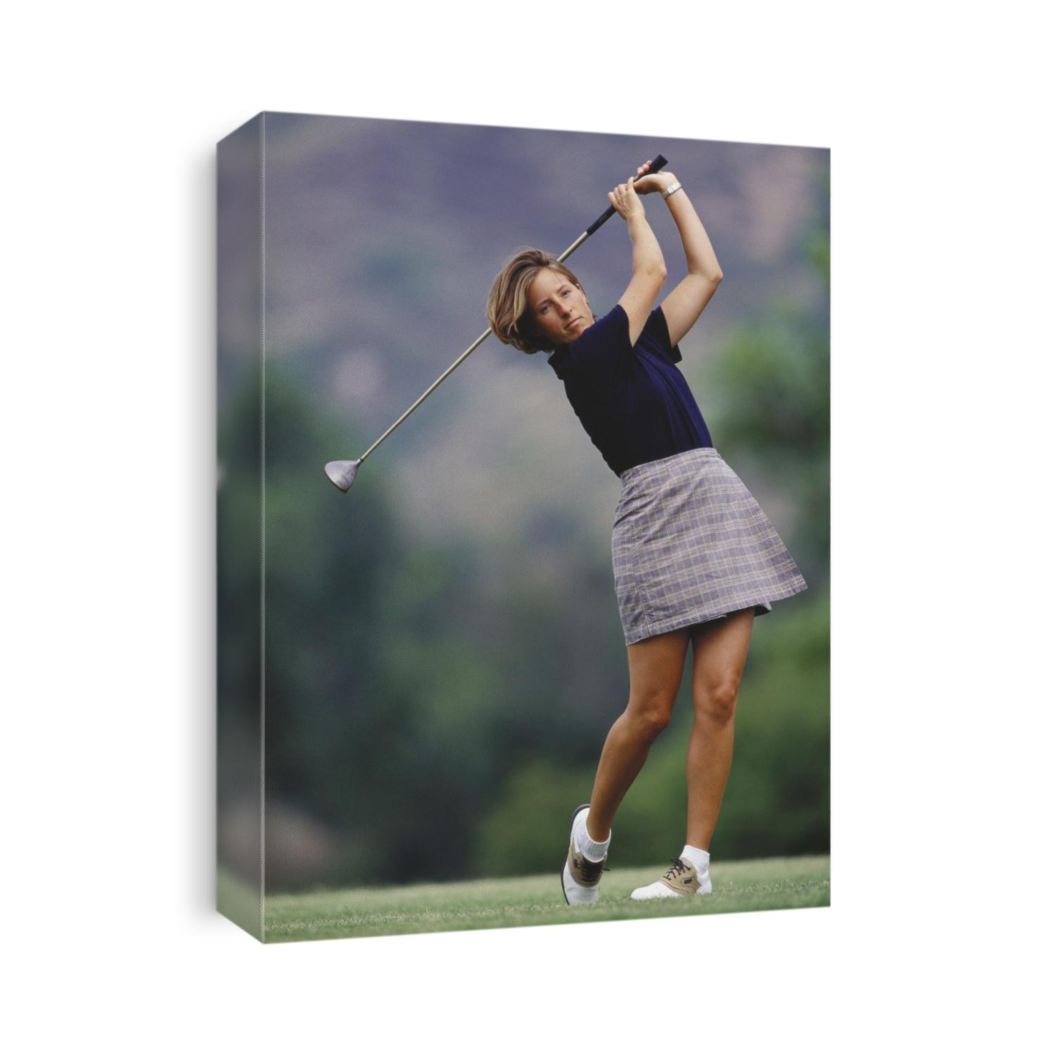 Woman golfer in action.