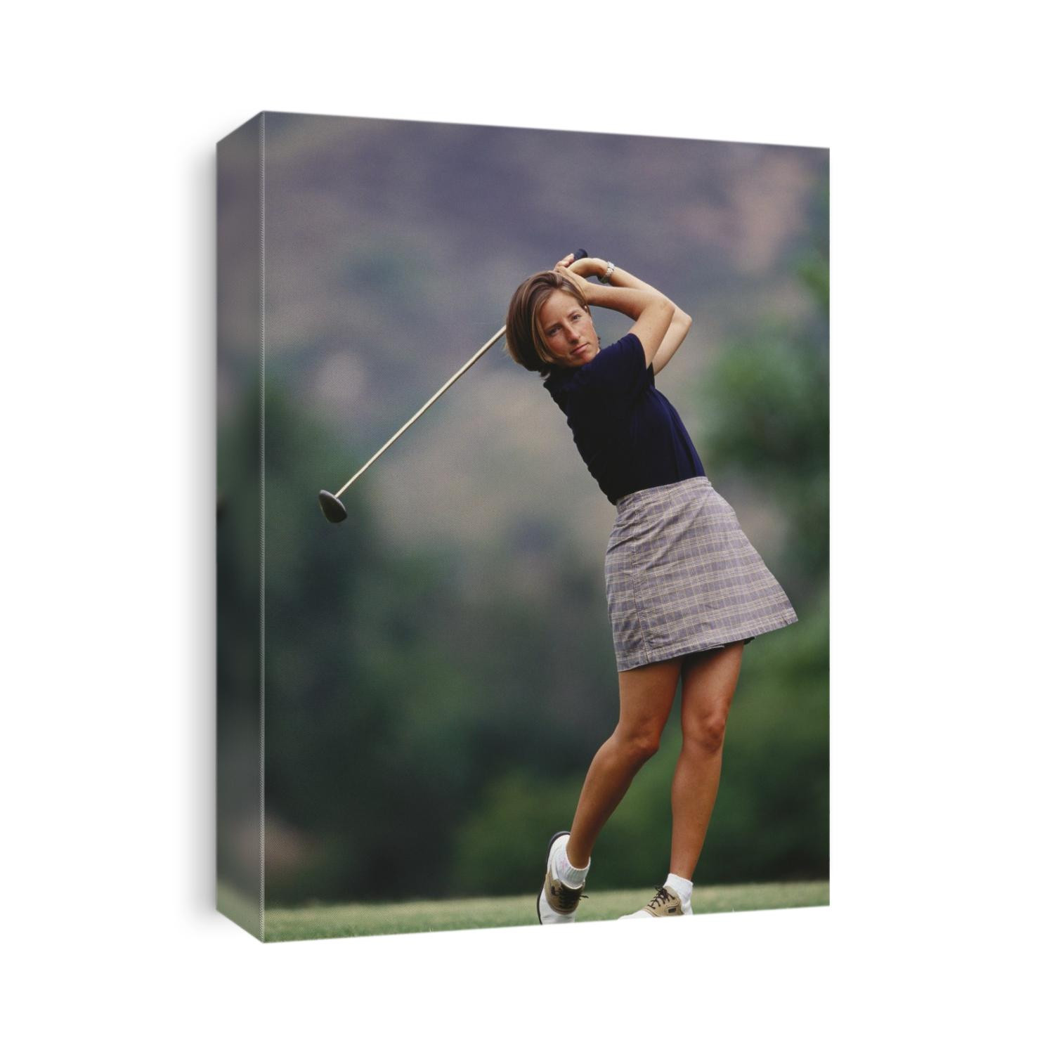 Woman golfer in action.