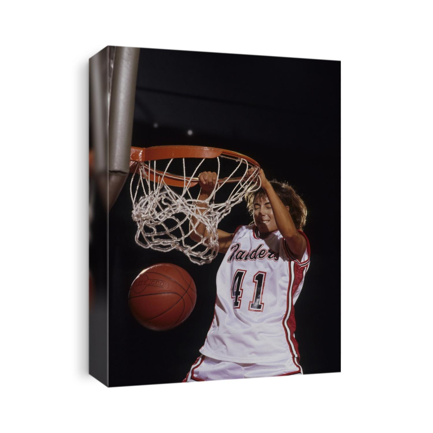 Female basketball player dunking a ball through the hoop,