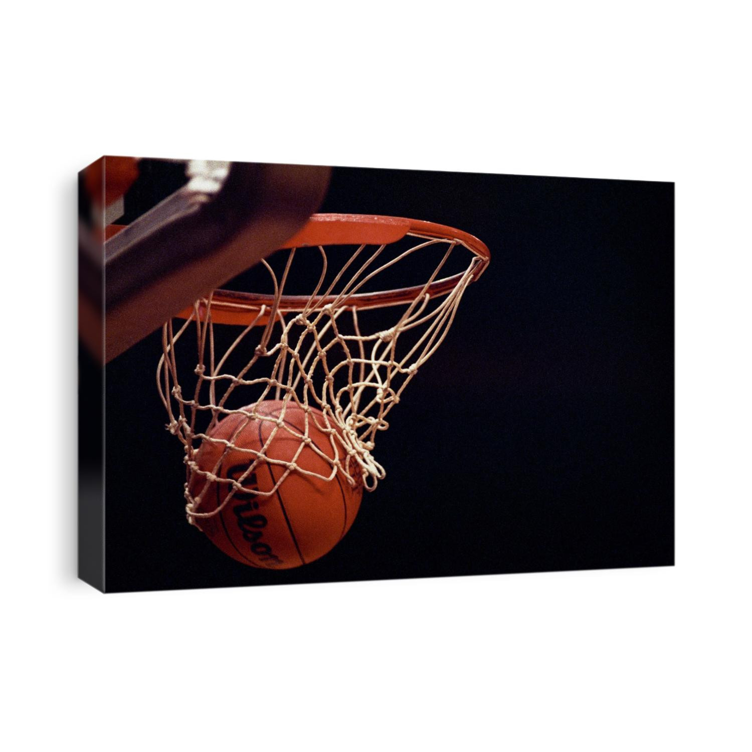 Basketball going through the hoop.