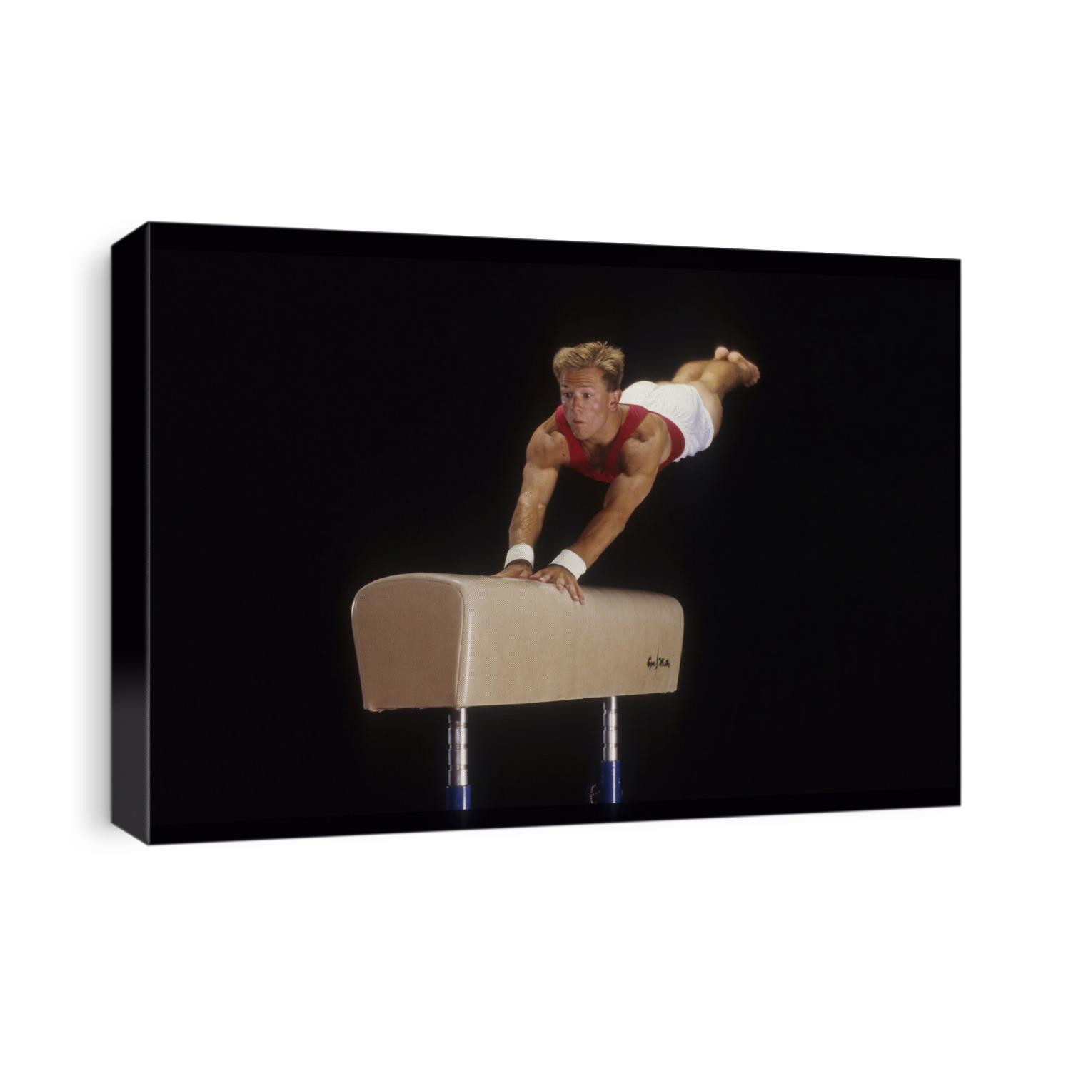 Male gymnast on the vault.