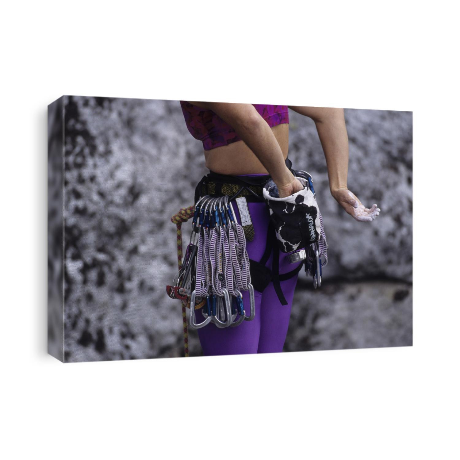 Close up of rock climbing equipment on a female climber.