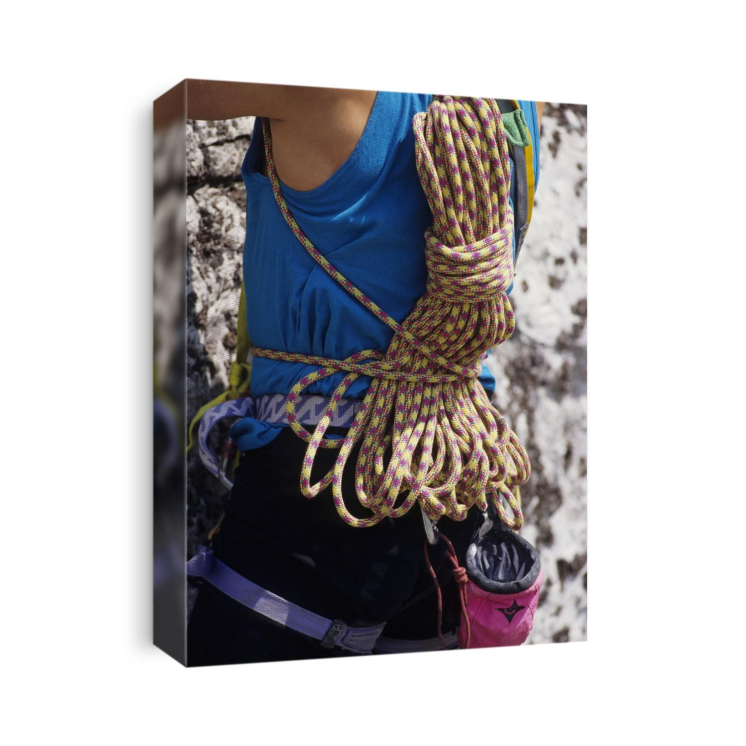 Rock climbing equipment on a climber's back.