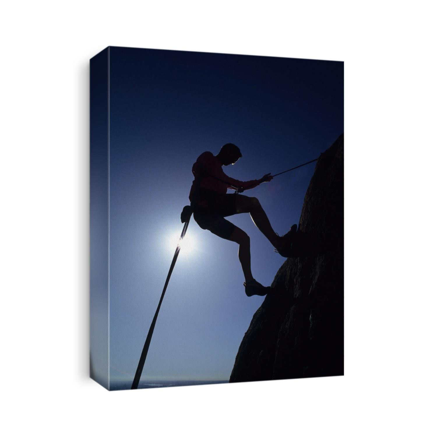 Silhouette of rock climber.