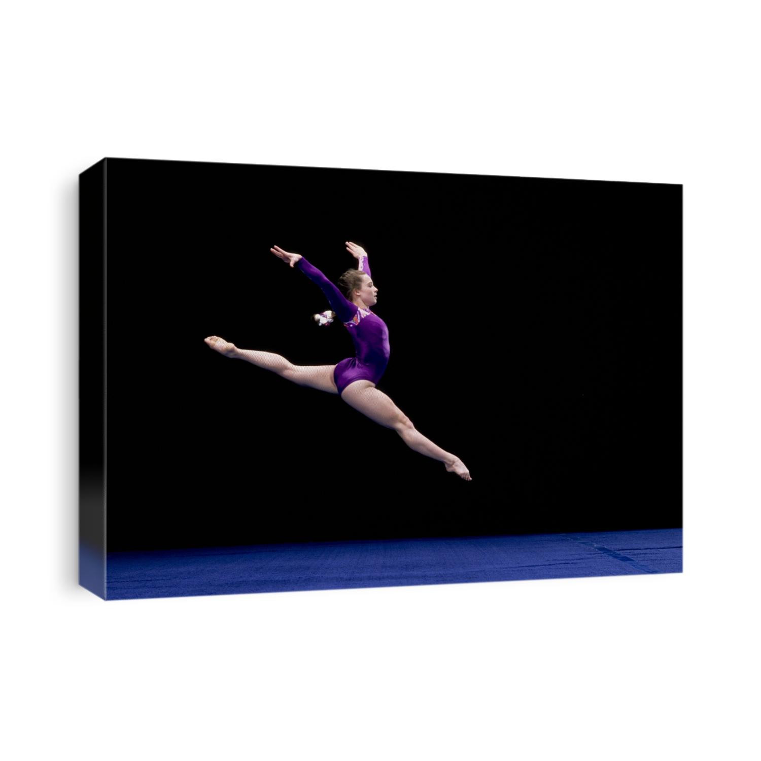 female gymnast performing on the floor exercise.