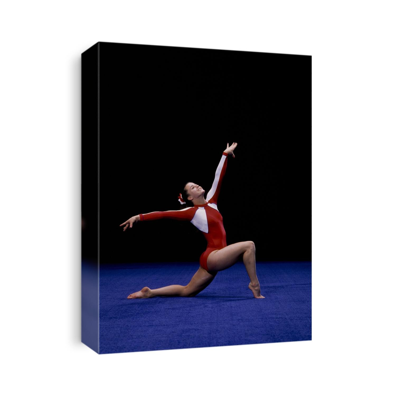 female gymnast performing on the floor exercise.