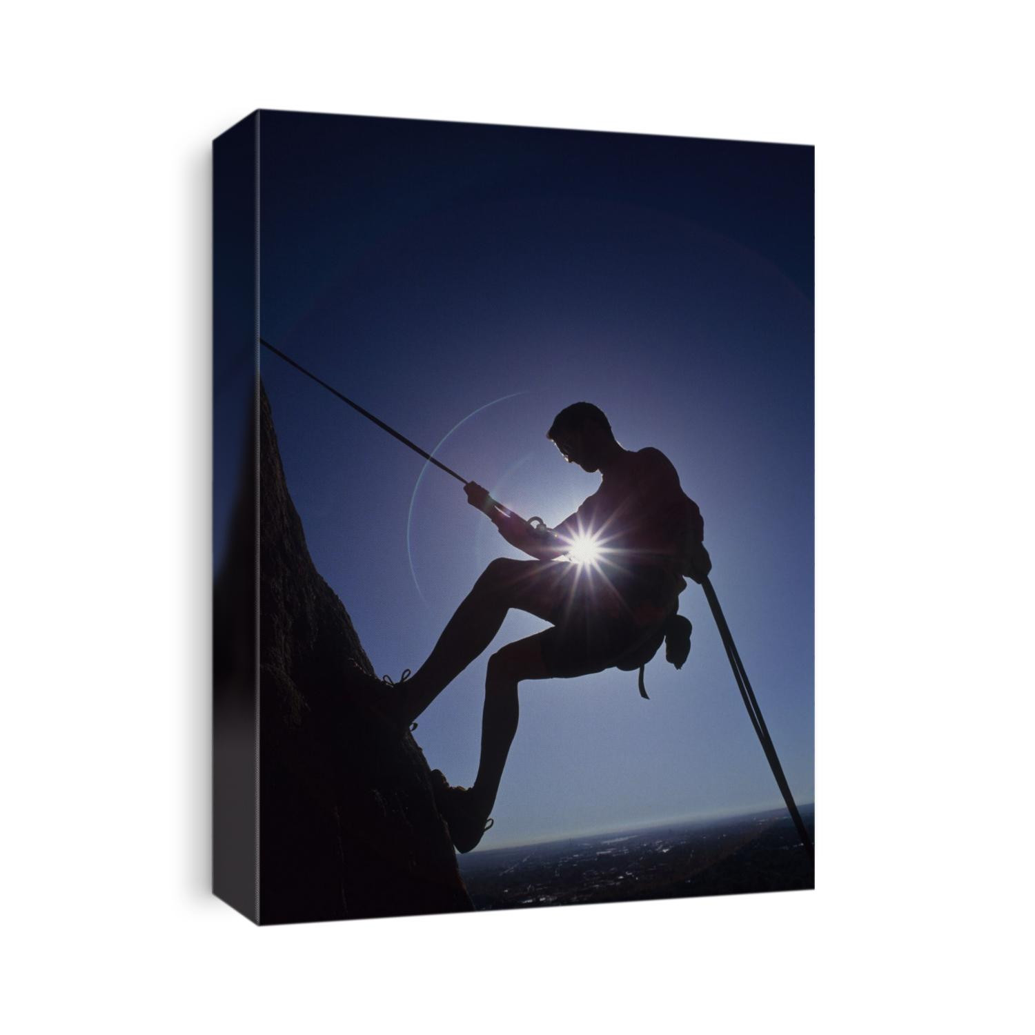 Silhouette of rock climber.